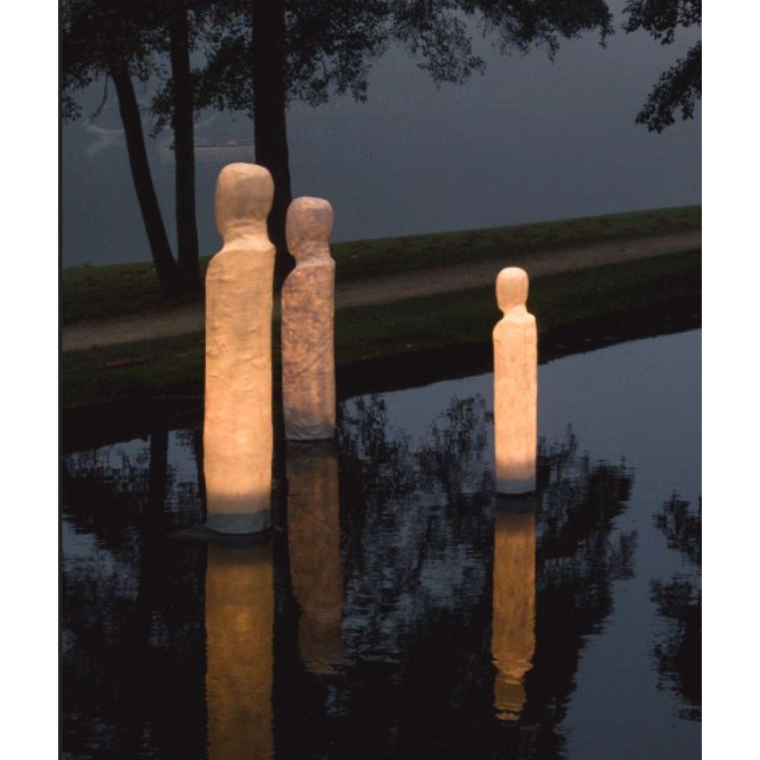 A set of 3 anonymus family - Light sculptures by Atelier Haute Cuisine
Dimensions: 180 x 28 cm, 185 x 34, 210 x 41 cm 
Materials: Fiberglass, UV, weather resistant topcoat, E27 LED, metal base
 
This serie of light sculptures is created through