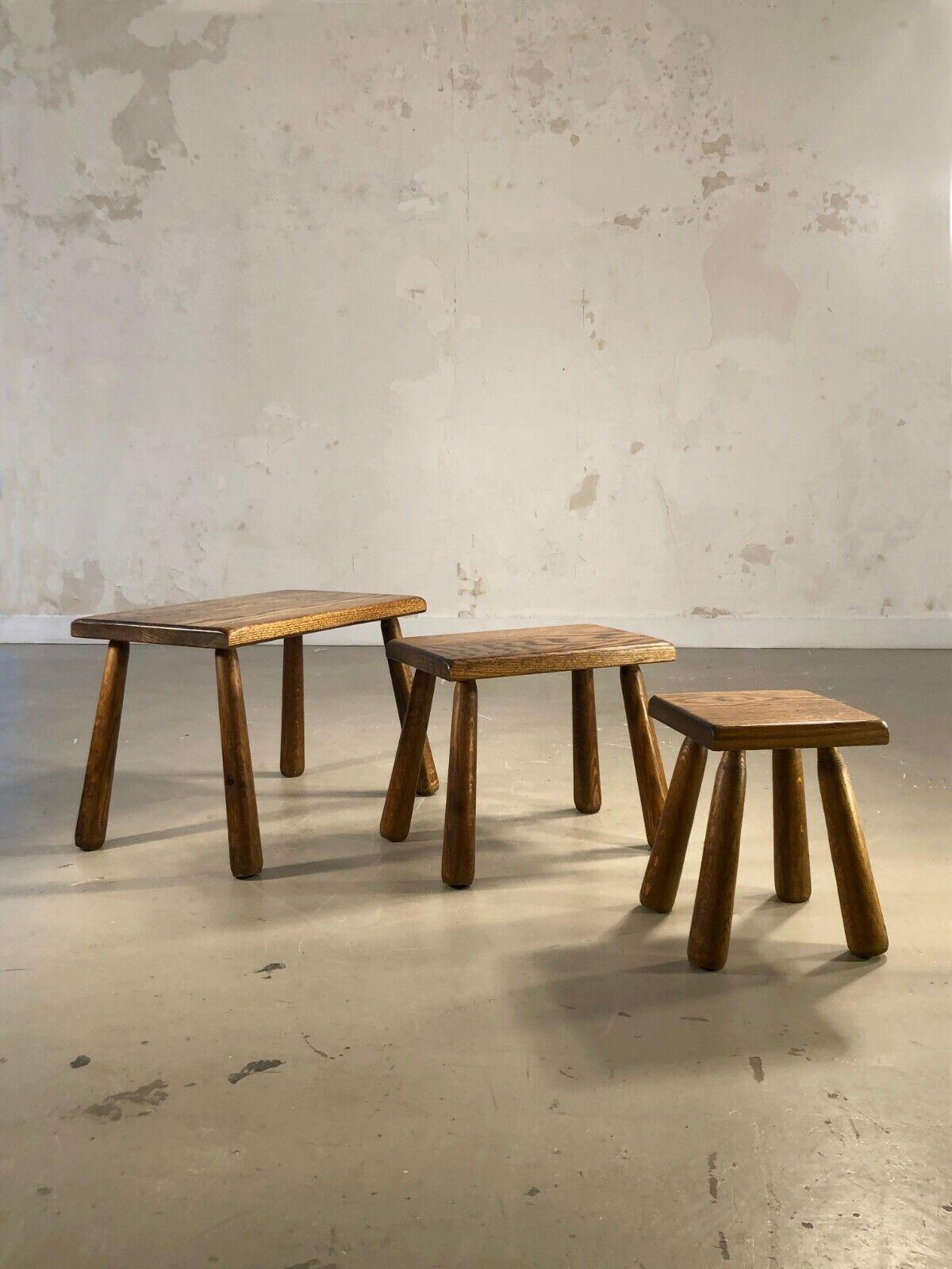 A set of 3 nesting tables, or side tables, bedside tables or end tables, Modernist, Brutalist, Popular Art, Free Form, in varnished solid wood, with club legs, To be attributed, France 1950-1960.

DIMENSIONS:
Large Table: 57 x 36.5 x 38.4 cm (Top 55