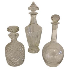 A set of 3 cut crystal decanters, or available individually.