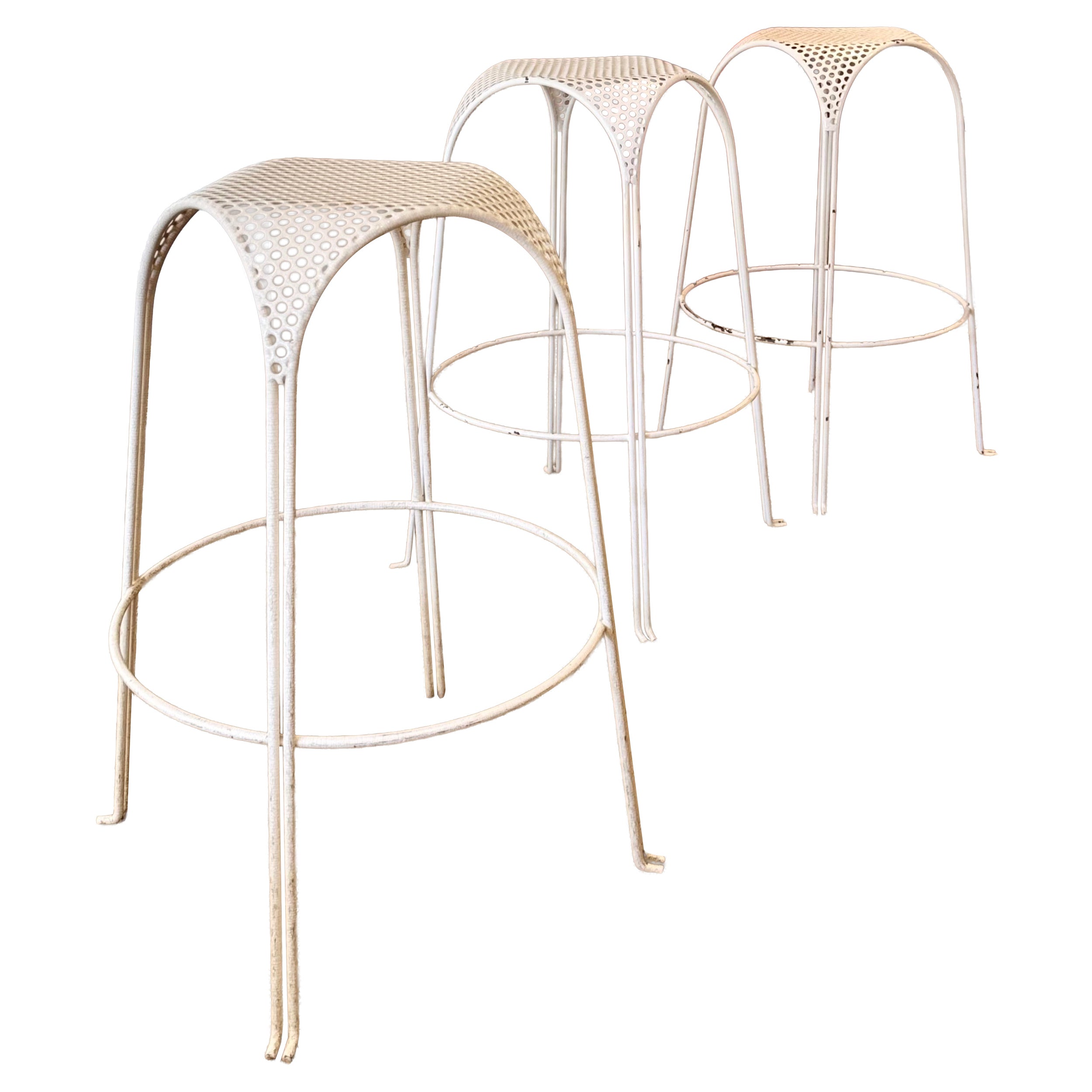 A set of 3 Italian mid century modern white perforated metal counter stools
