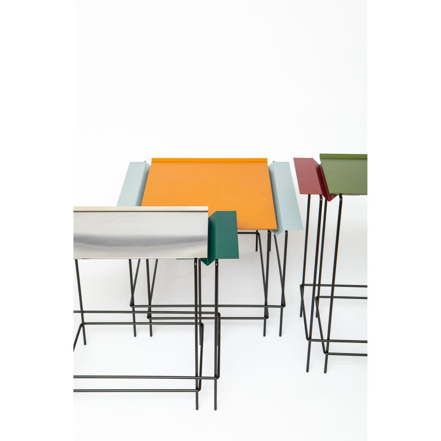 A Set of 3 Leva - tables by Alva Design
Materials: Painted Metal, Stainless Steel
Dimensions: 643 x 60 x 32, 60 x 50 x 32, 60 x 40 x 59 cm

ALVA is a furniture and objects design office, formed by brothers Susana Bastos, artist and designer, and
