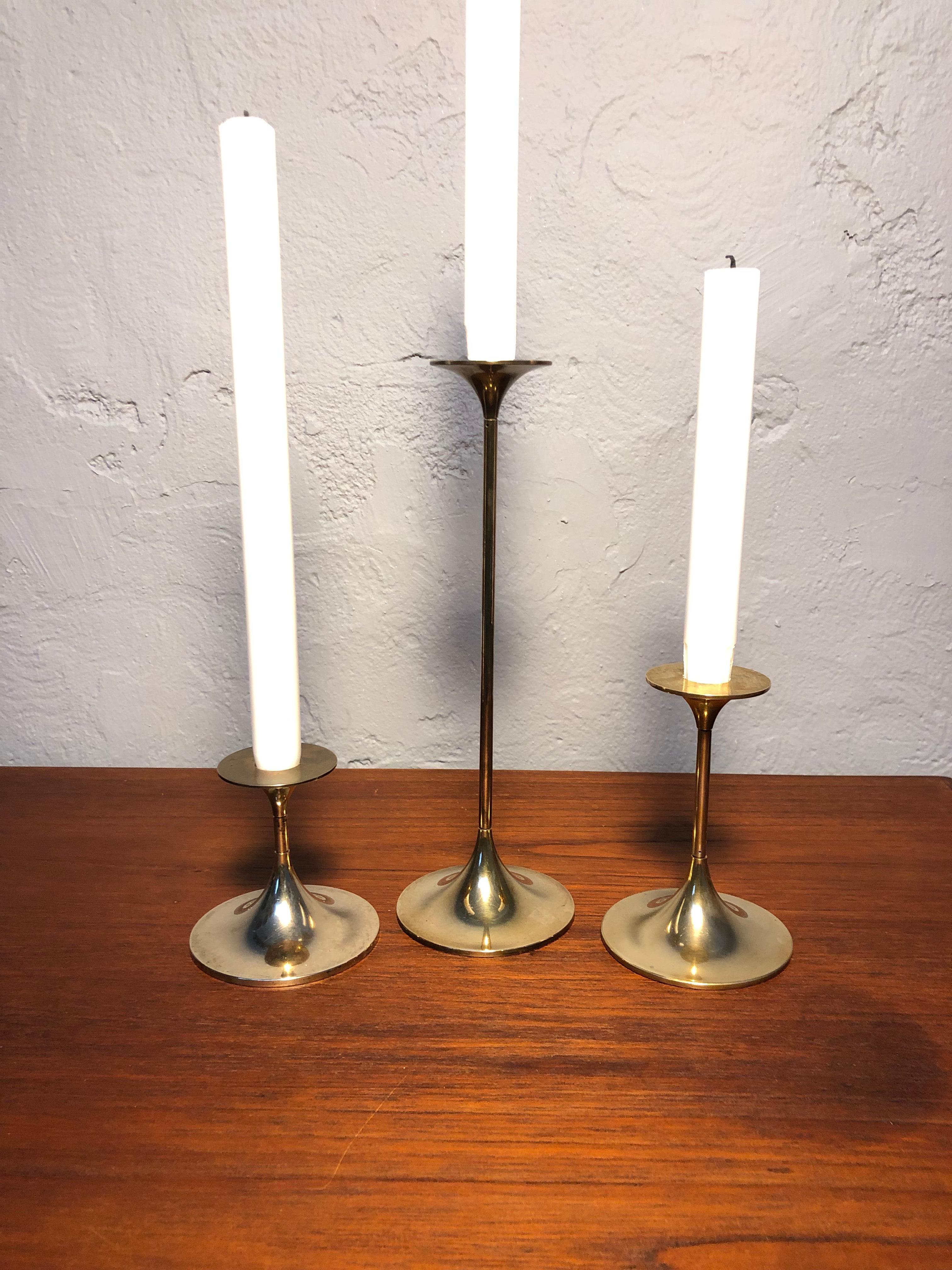 A set of 3 Mid-Century Modern brass candle holders by Torben Ørskov of Copenhagen. 
Three heights 9, 13 and 26cm. 
Stamped at the base and top “TØ made in Denmar“
Can be polished if so desired. 
Age related wear and patina.
Great mid century