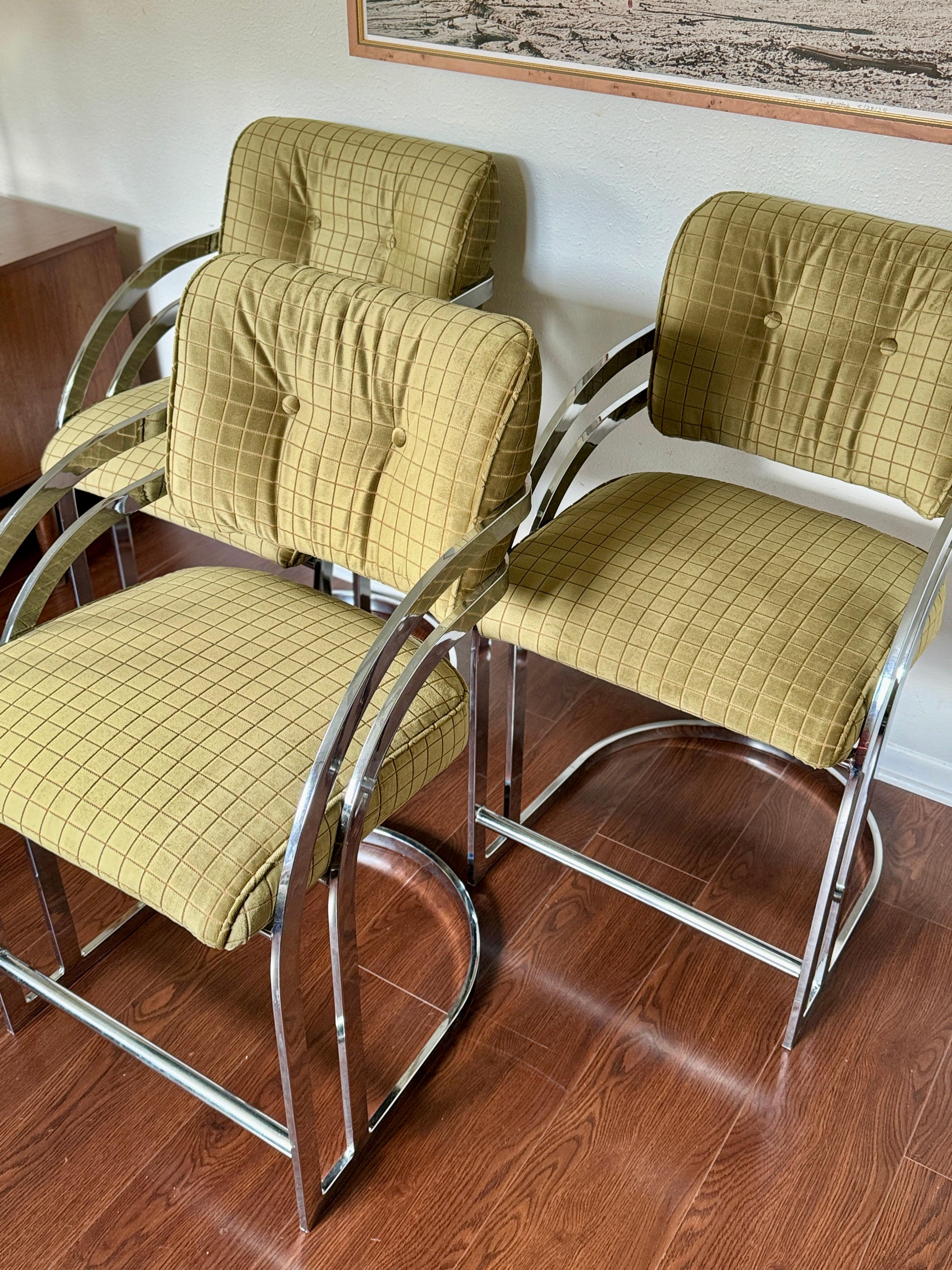 A set of 3 mid century modern counter stools in the style of Milo Baughman, circa 1970s. These have been recently recovered in a sage checkered velvet, and are in amazing condition. Structurally sound, and very little wear on the