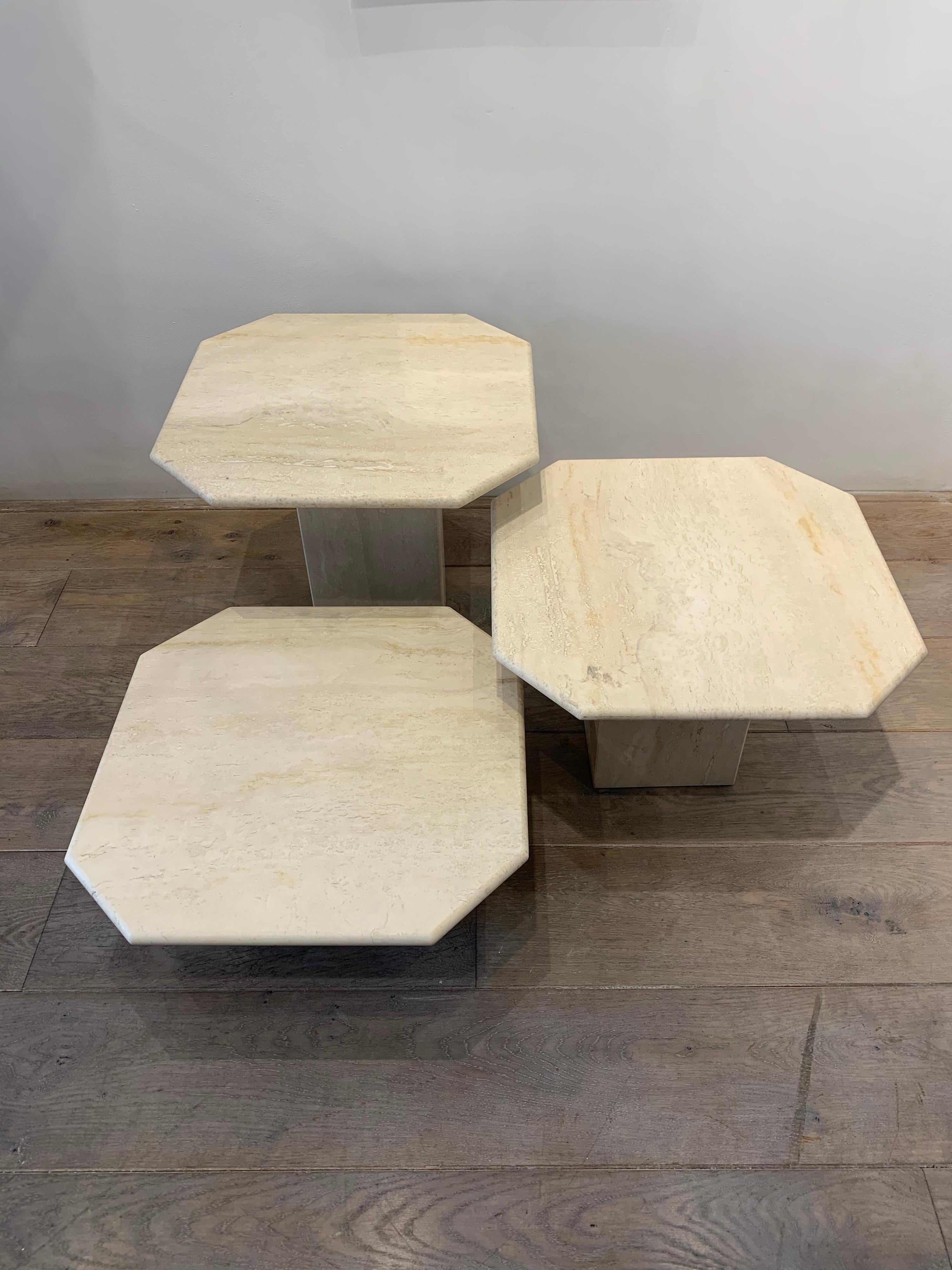 The tables have different sizes in height. 

The bigger one is 42cm height. 
Middle one 32cm height. 
Small one 22cm height.