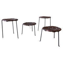 A set of 4 1940
s Swift and Monell Woven Leather and Iron Stools Mid Century