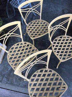 A Set of 4 Brown Jordan 1960's Yellow-Painted Aluminum Garden Chairs