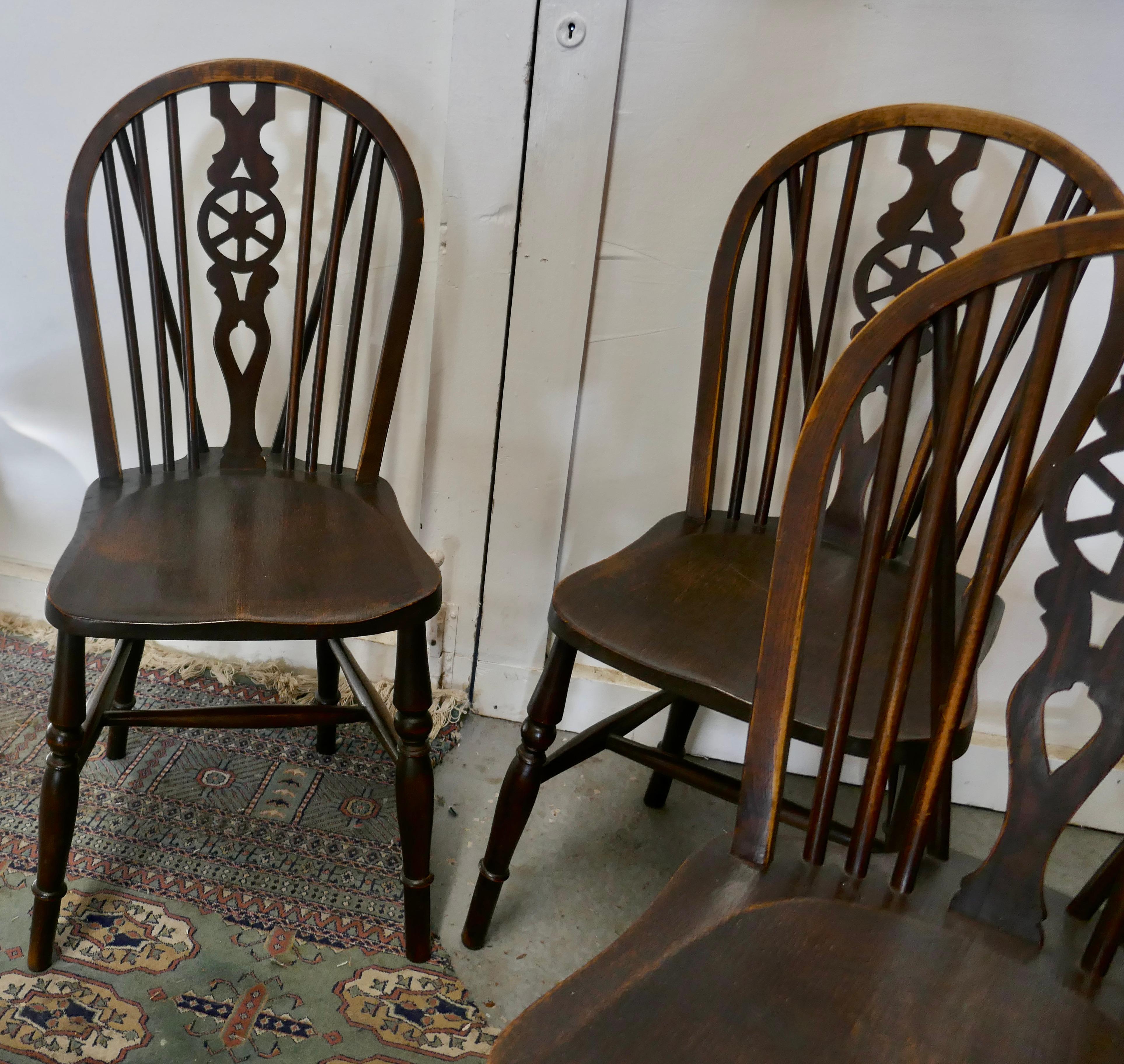 A set of 4 beech & elm wheel back windsor kitchen dining chairs


The chairs are a Classic design and traditionally made from solid wood they have hooped wedge backs in the traditional Windsor style with spindles and a pierced centre splat in the