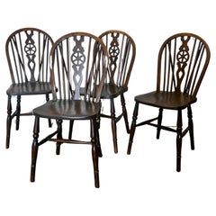 A Set of 4 Beech & Elm Wheel Back Windsor Kitchen Dining Chairs