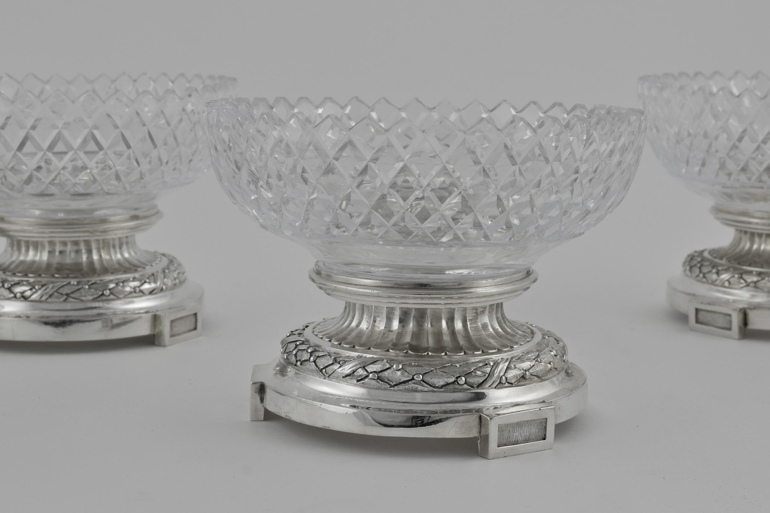 Excellent quality circular form set of 4 dessert stand comports. Classically styled with fluted decoration and cross cut glass bowls.