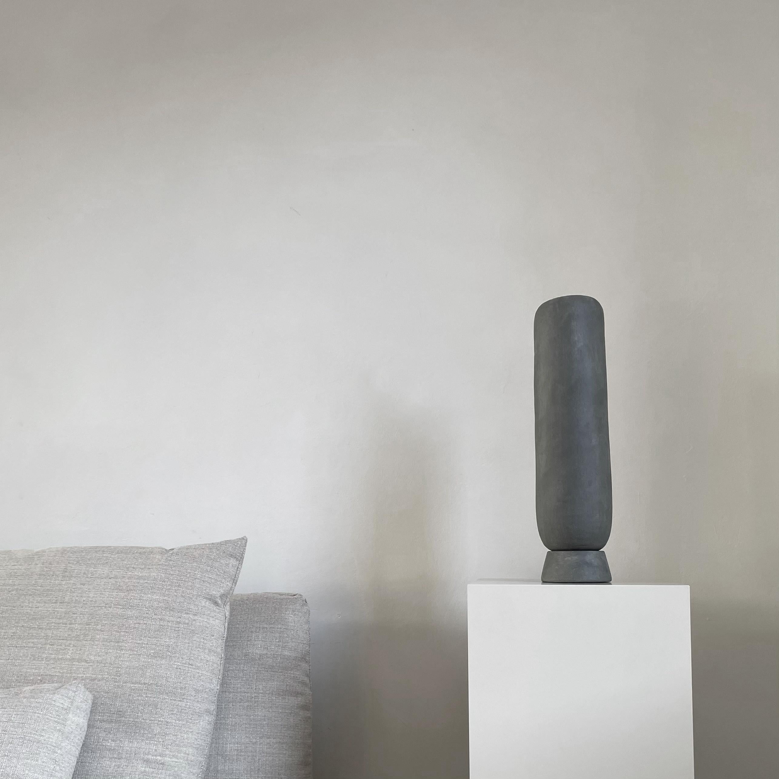 A Set of 4 Dark Grey Kabin Vase Tall by 101 Copenhagen
Designed by Kristian Sofus Hansen & Tommy Hyldahl
Dimensions: L10 / W10 / H45 CM
Materials: Ceramic

Kabin is a collection of handmade ceramic vases that is inspired from Japanese