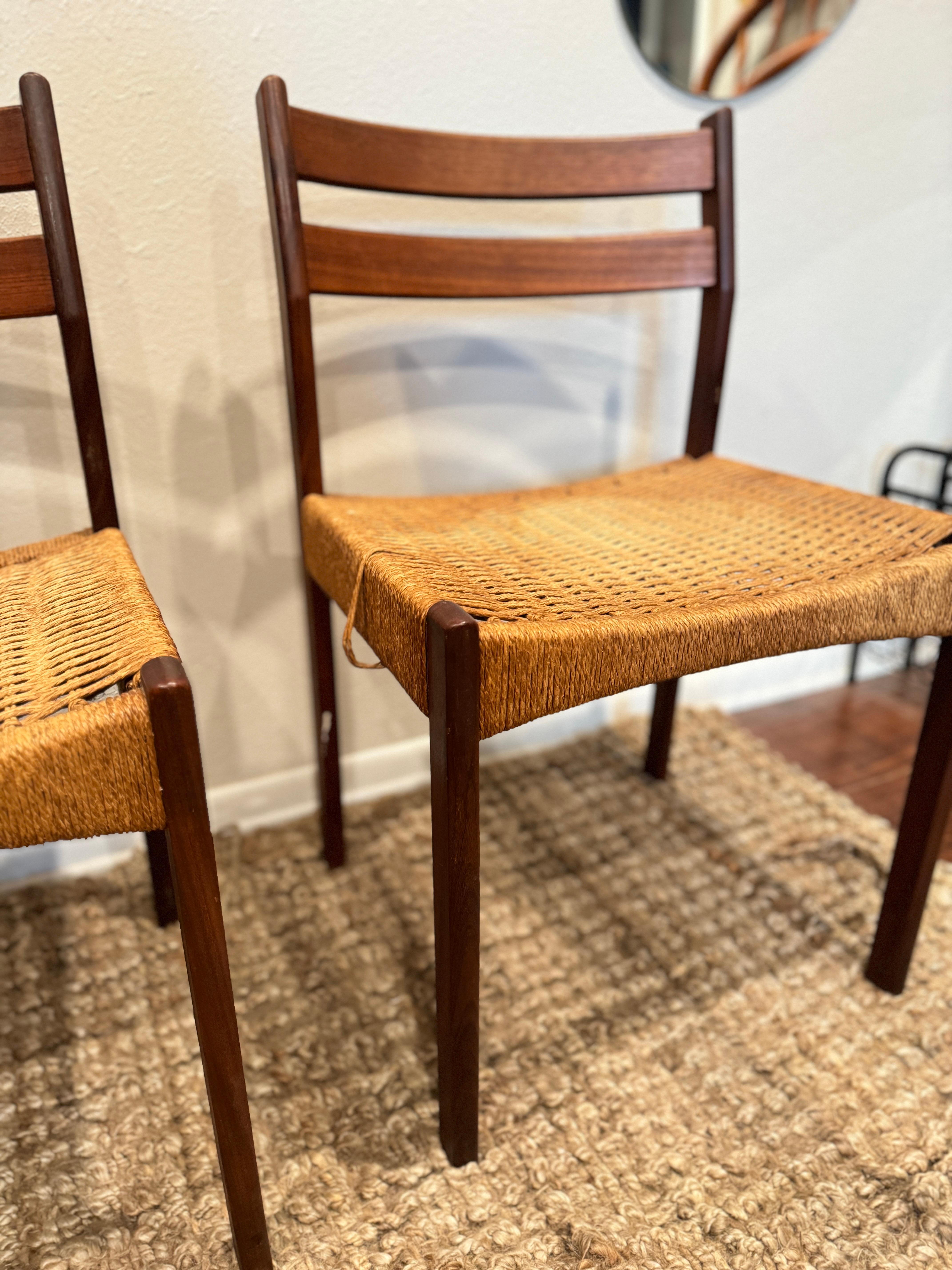a set of 4 dining chairs designed by Arne Hovmand Olsen, produced by Mogens Kold, circa 1950s. The chairs are made from teak with original paper cord seating. They’re structurally sound, but the seats do have some wear. Totally useable as
