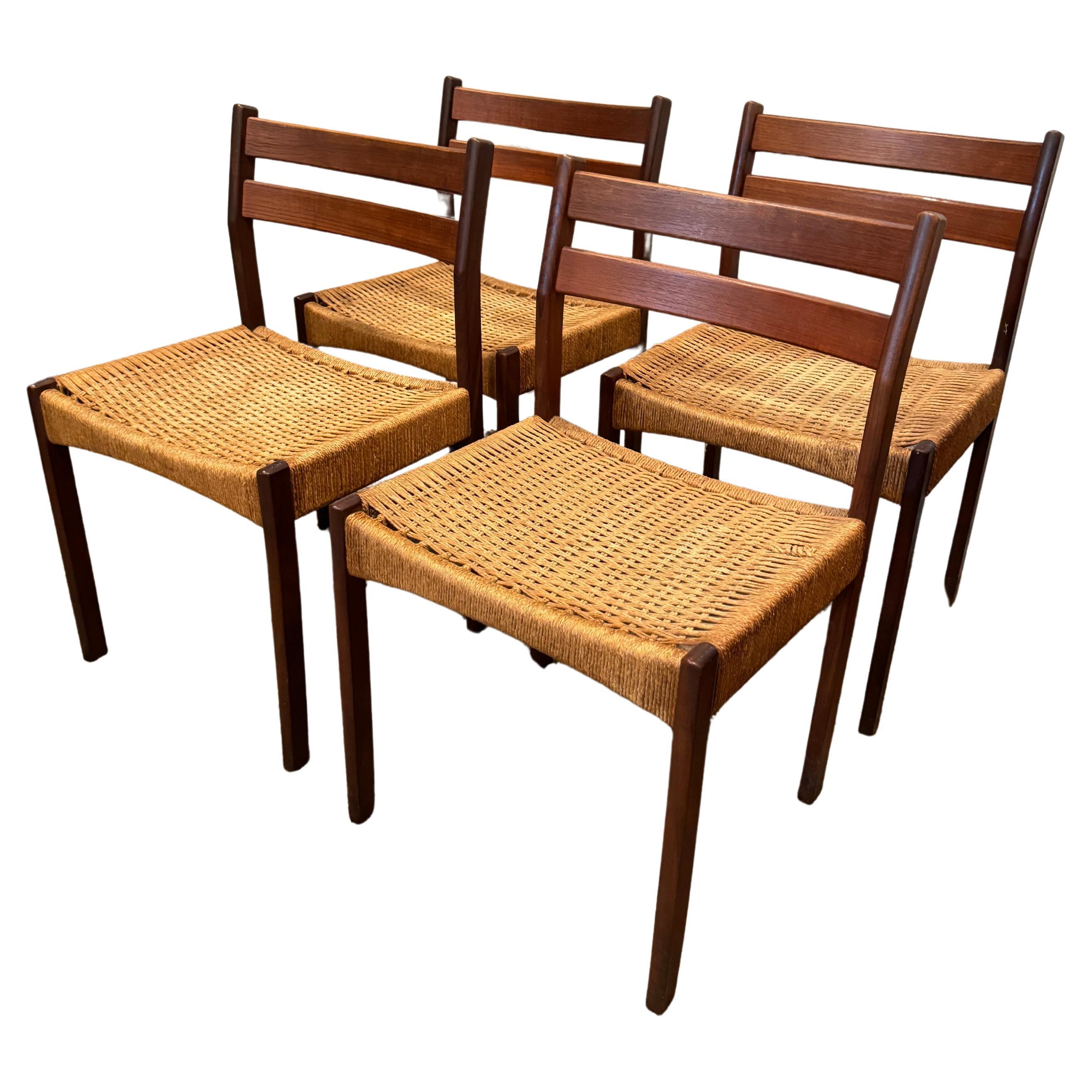 a set of 4 dining chairs designed by Arne Hovmand Olsen, produced by Mogens Kold For Sale
