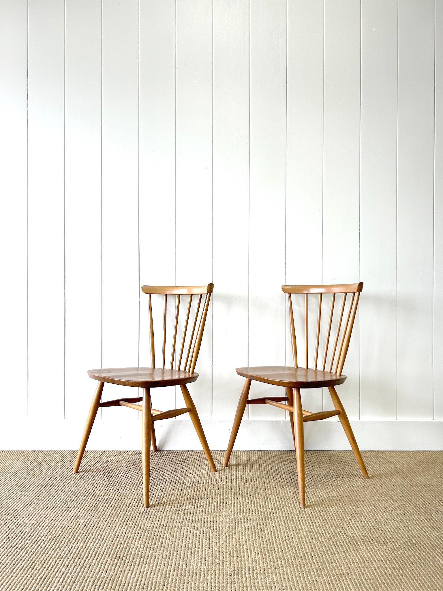 Mid-Century Modern A Set of 4 Ercol Stick Back or Windsor Chairs For Sale