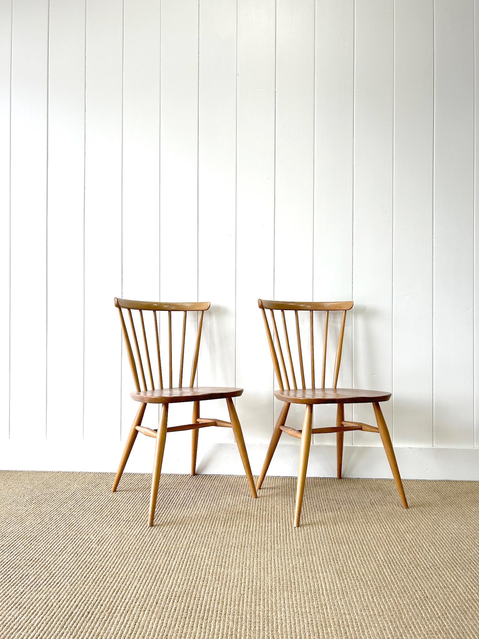 British A Set of 4 Ercol Stick Back or Windsor Chairs For Sale