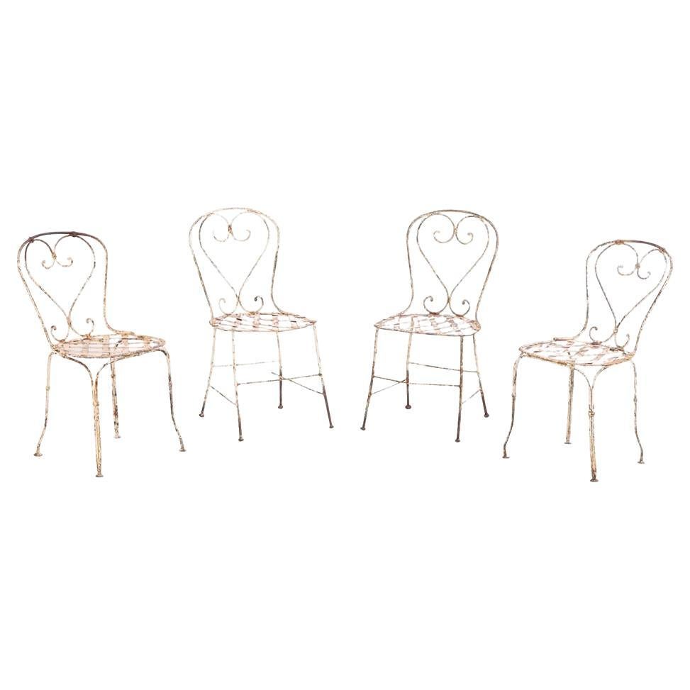 Un ensemble de 4 chaises de jardin en fer français, C. 1950. en vente