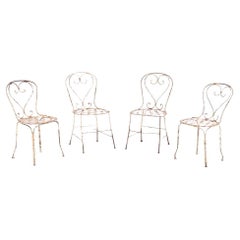 A set of 4 French iron garden chairs, C. 1950.