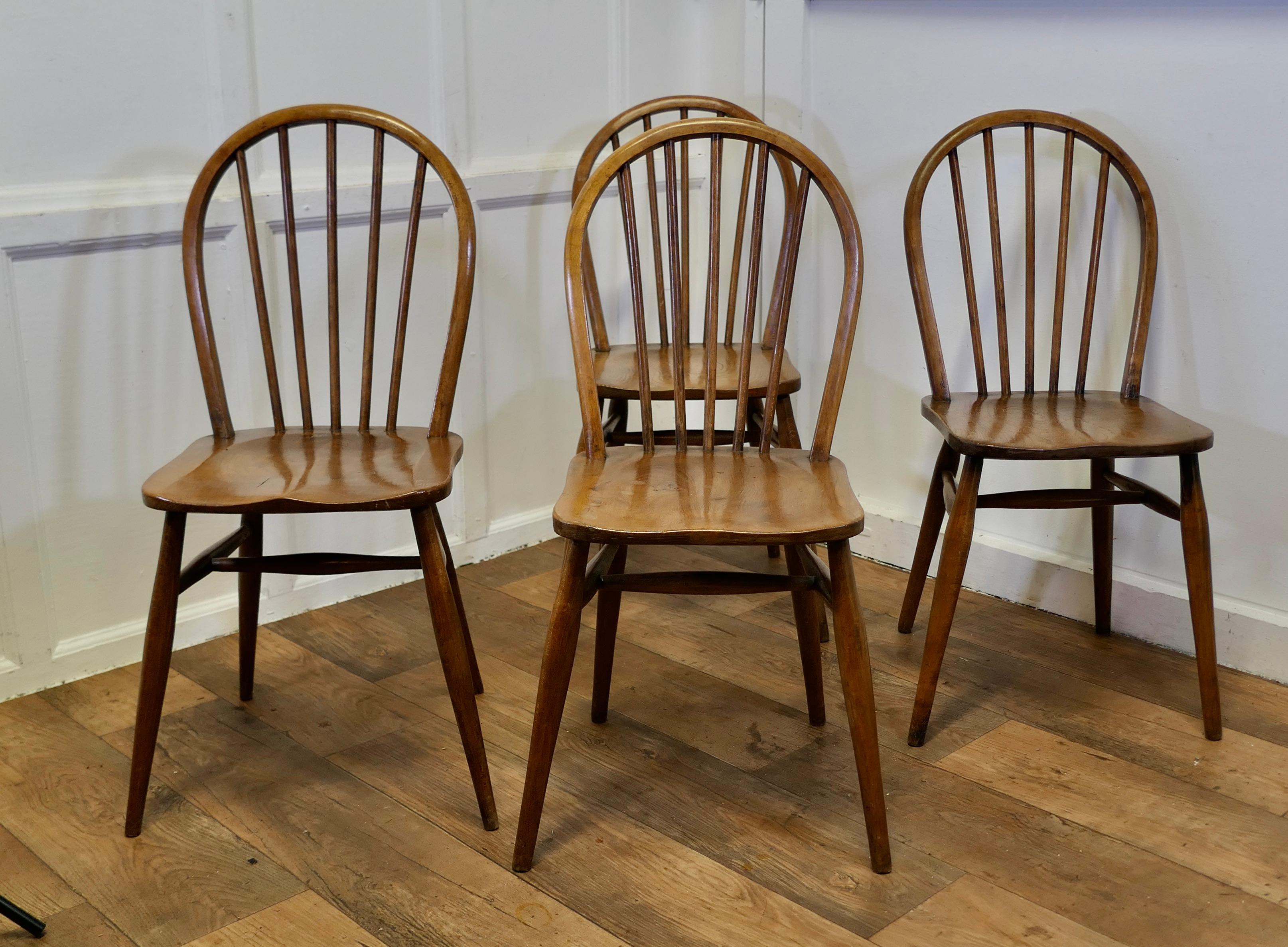 A Set of 4 Golden Beech and Elm Windsor Country Dining Chairs 

The chairs are of superb quality, they are craftsman made and are very roomy and comfortable The chairs are in solid elm with a hooped back and turned spindles
The chairs are very