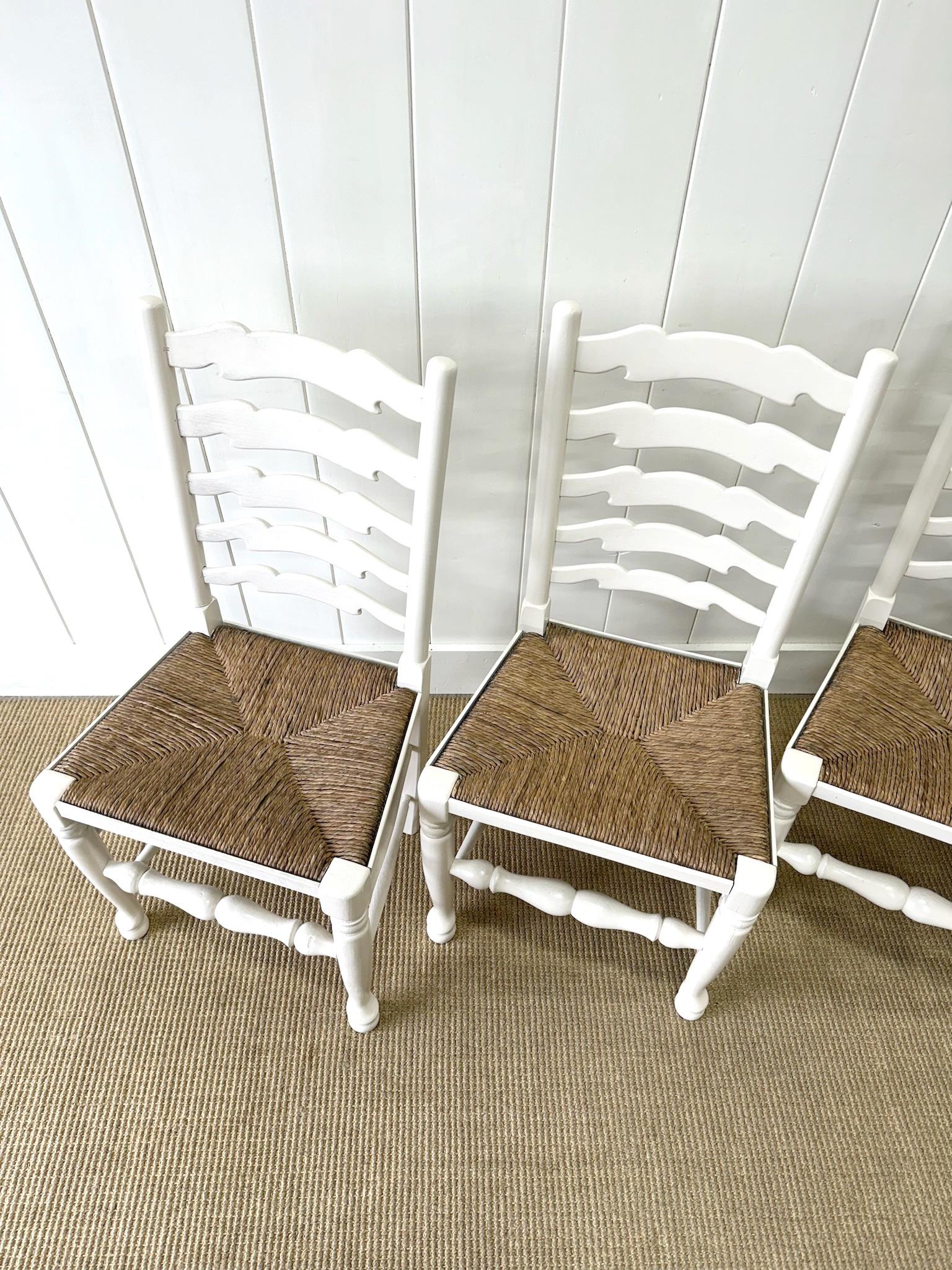Mid-Century Modern A Set of 4 Ladderback Rush Seat Chairs Painted White For Sale