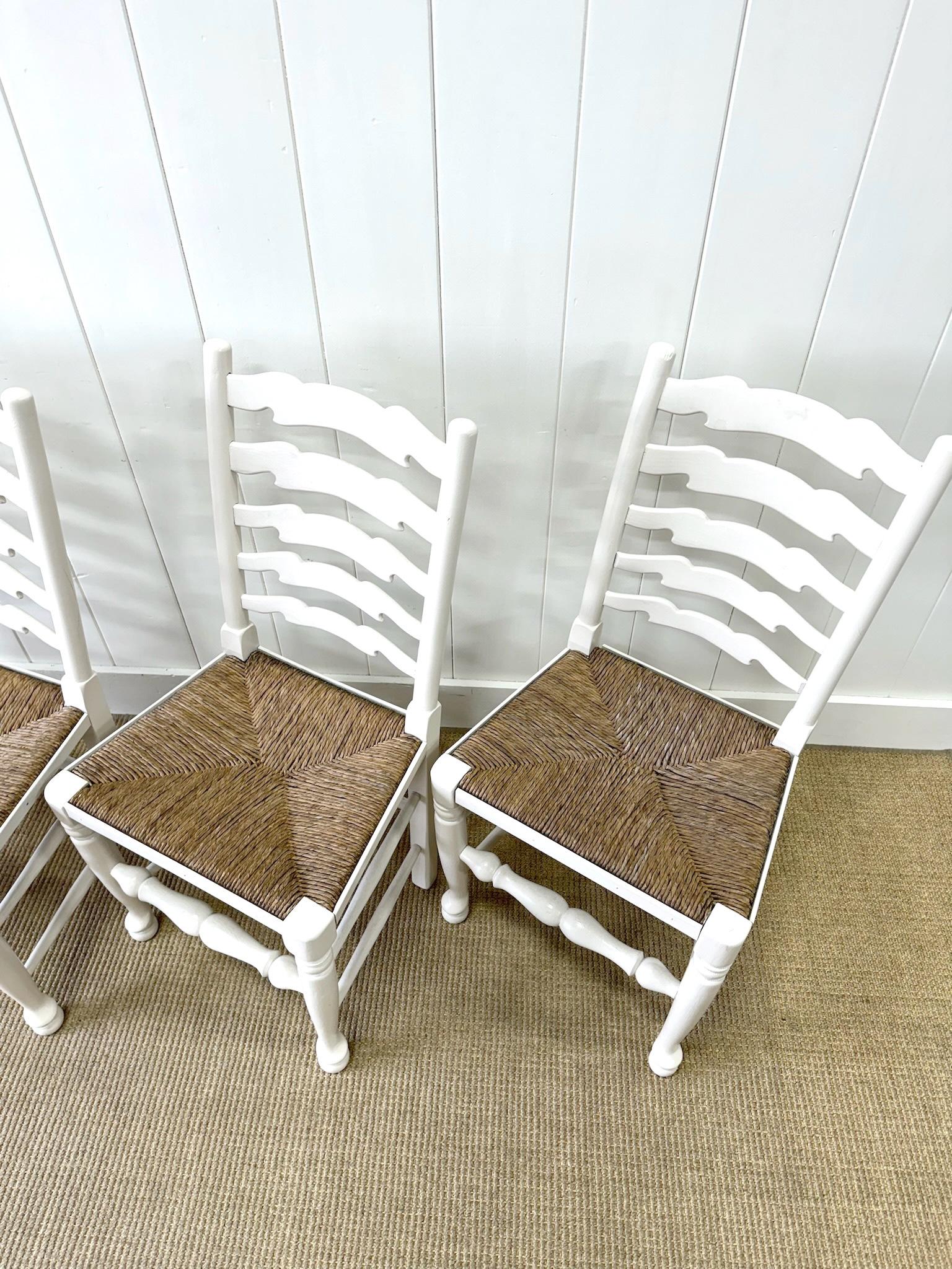 British A Set of 4 Ladderback Rush Seat Chairs Painted White For Sale