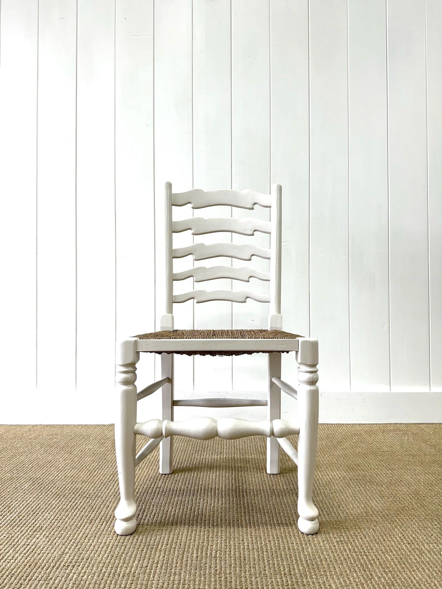 A Set of 4 Ladderback Rush Seat Chairs Painted White In Good Condition For Sale In Oak Park, MI