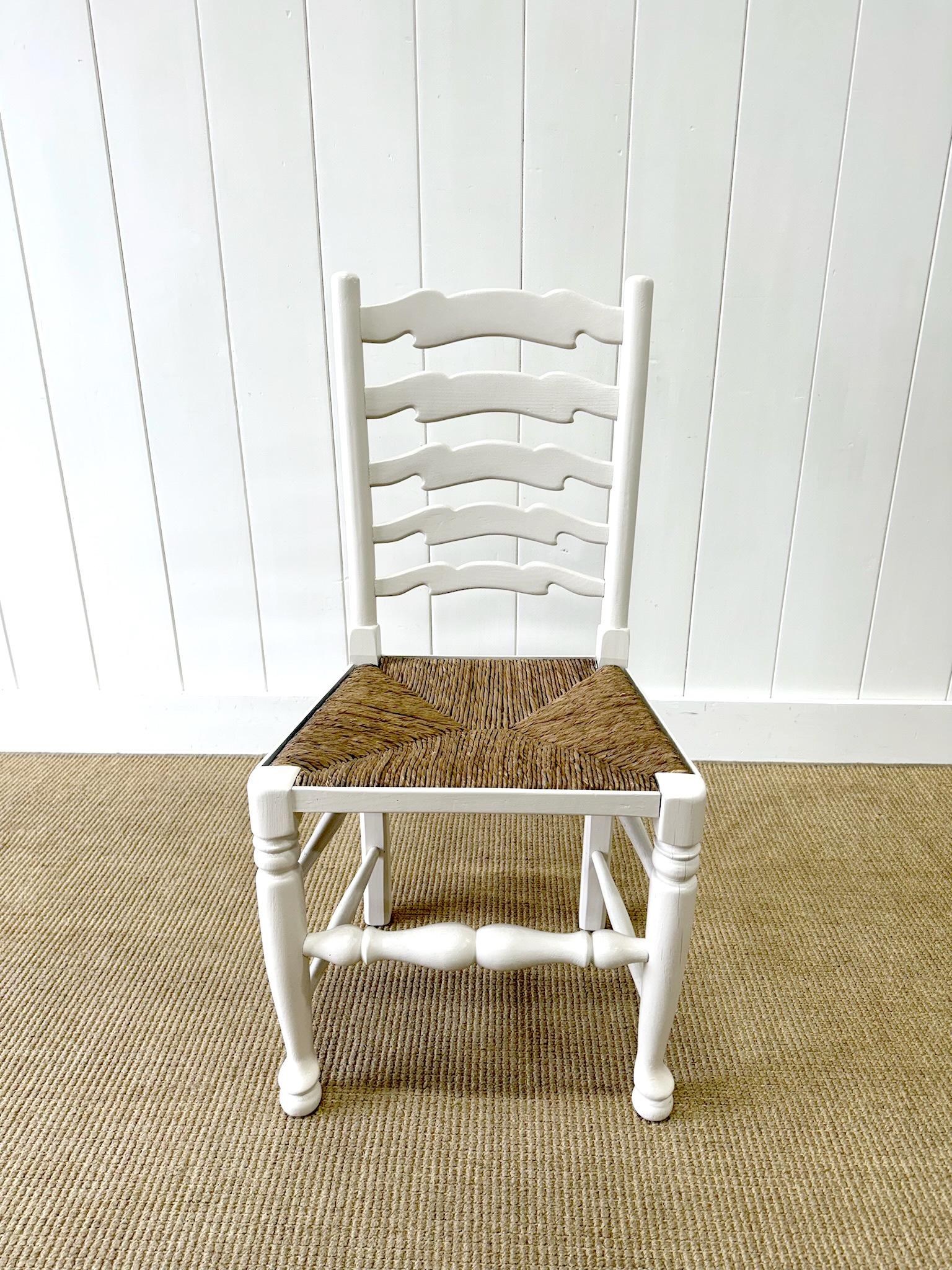 20th Century A Set of 4 Ladderback Rush Seat Chairs Painted White For Sale