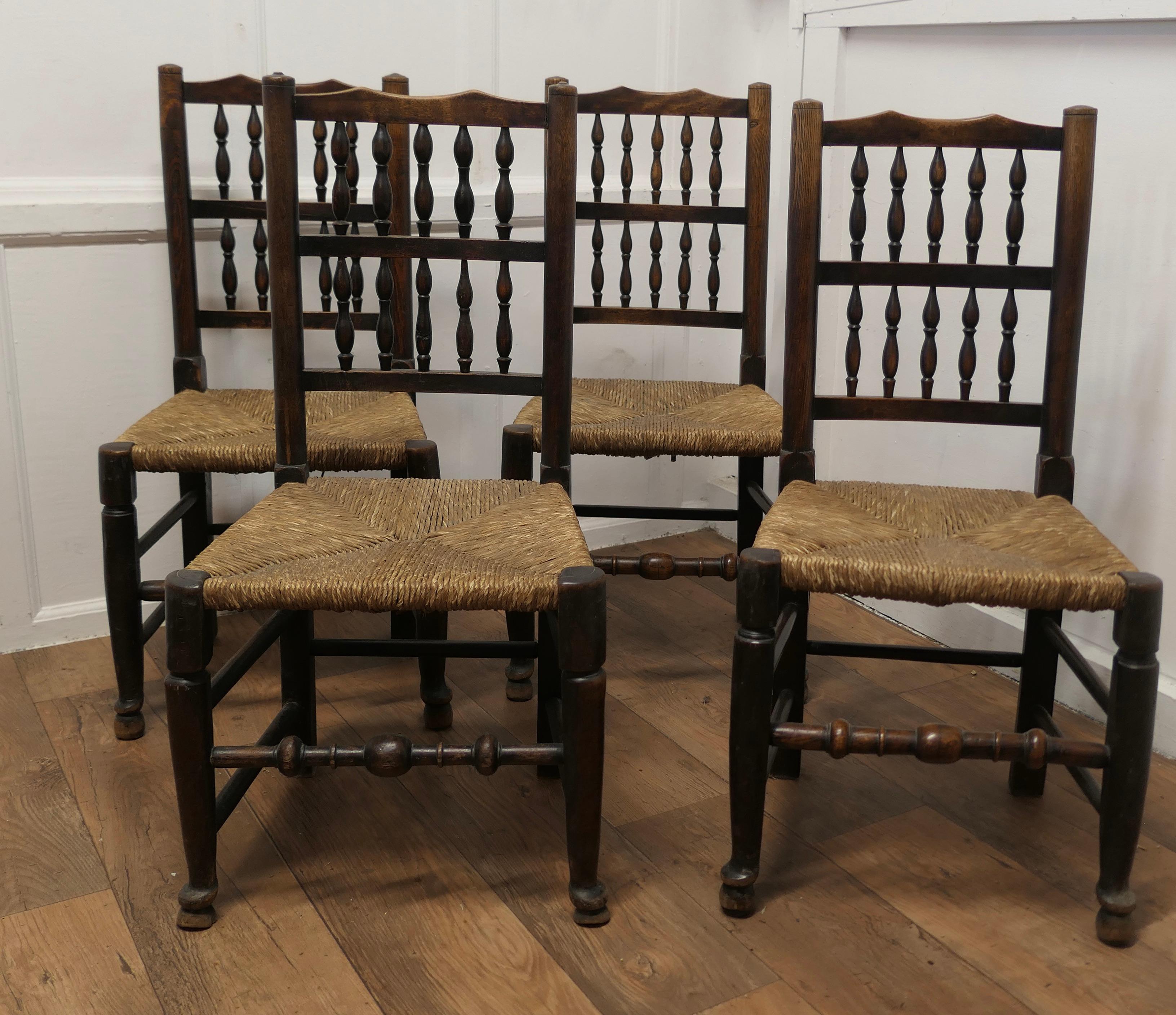 A Set of 4 Lancashire Spindle Back Farmhouse Kitchen Dining Chairs

This very attractive set of chairs with turned spindle backs have sturdy pad feet and turned stretchers all round for strength, the front stretcher is very chunky
The chairs have
