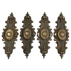 Un ensemble de 4 grandes plaques anciennes en bronze coulé