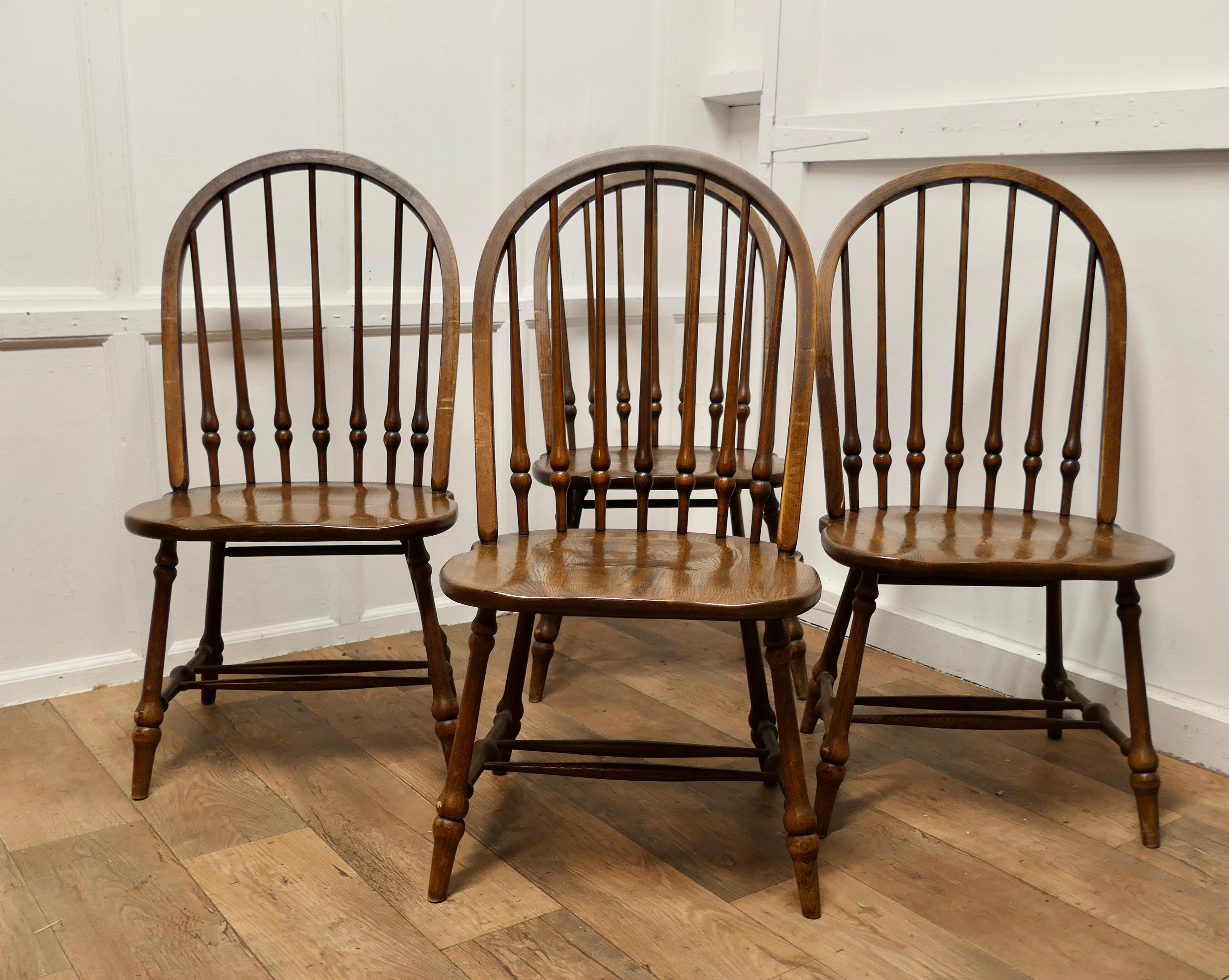 A Set of 4 Large Elm Windsor Country Dining Chairs 

The chairs are of superb quality, they are craftsman made and are very roomy and comfortable The chairs are in solid elm with a hooped back and turned spindles, they have double stretchers beneath