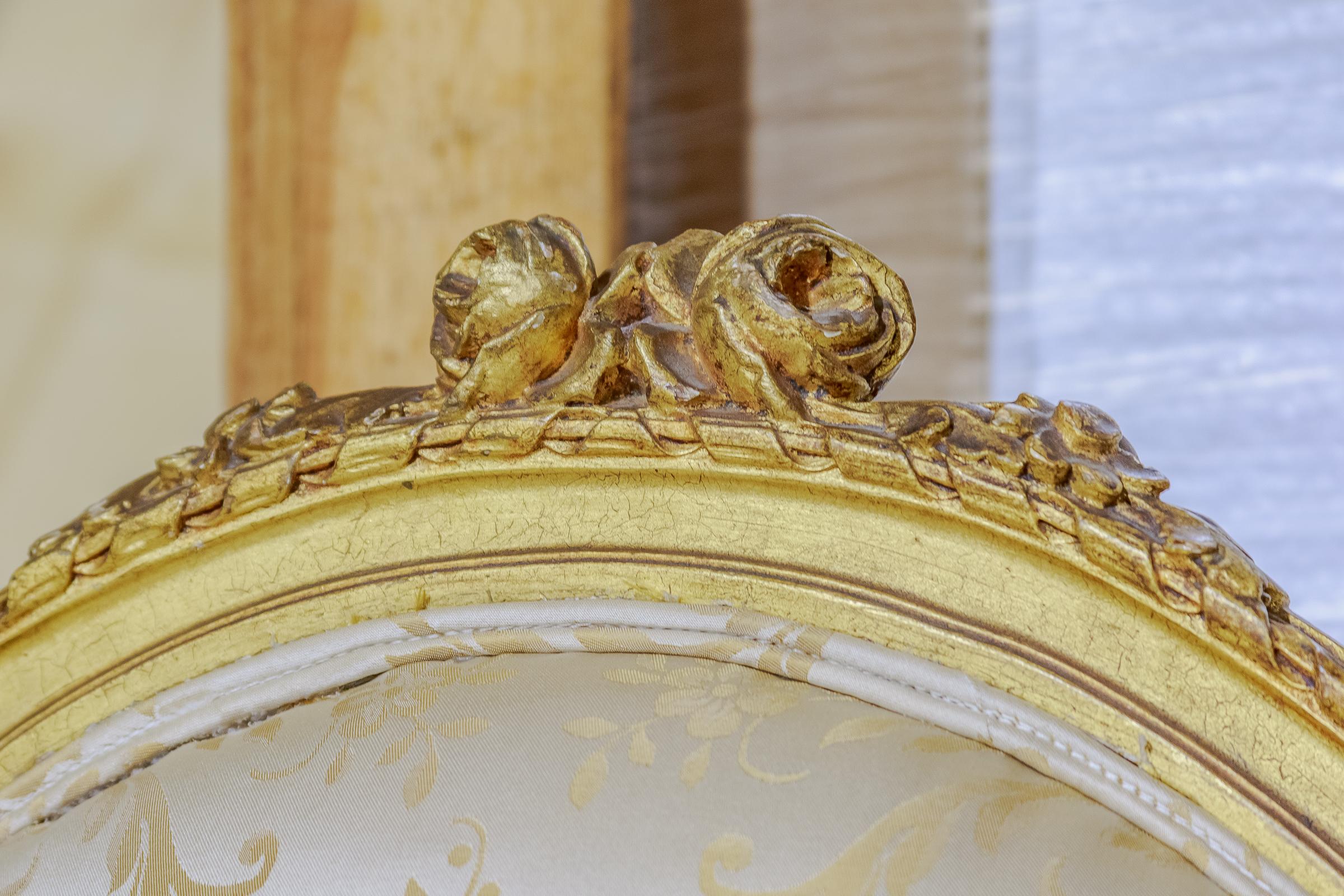 A set of 4 19th century French Louis XVI oval back fauteiuls. Carved and gilt large size.