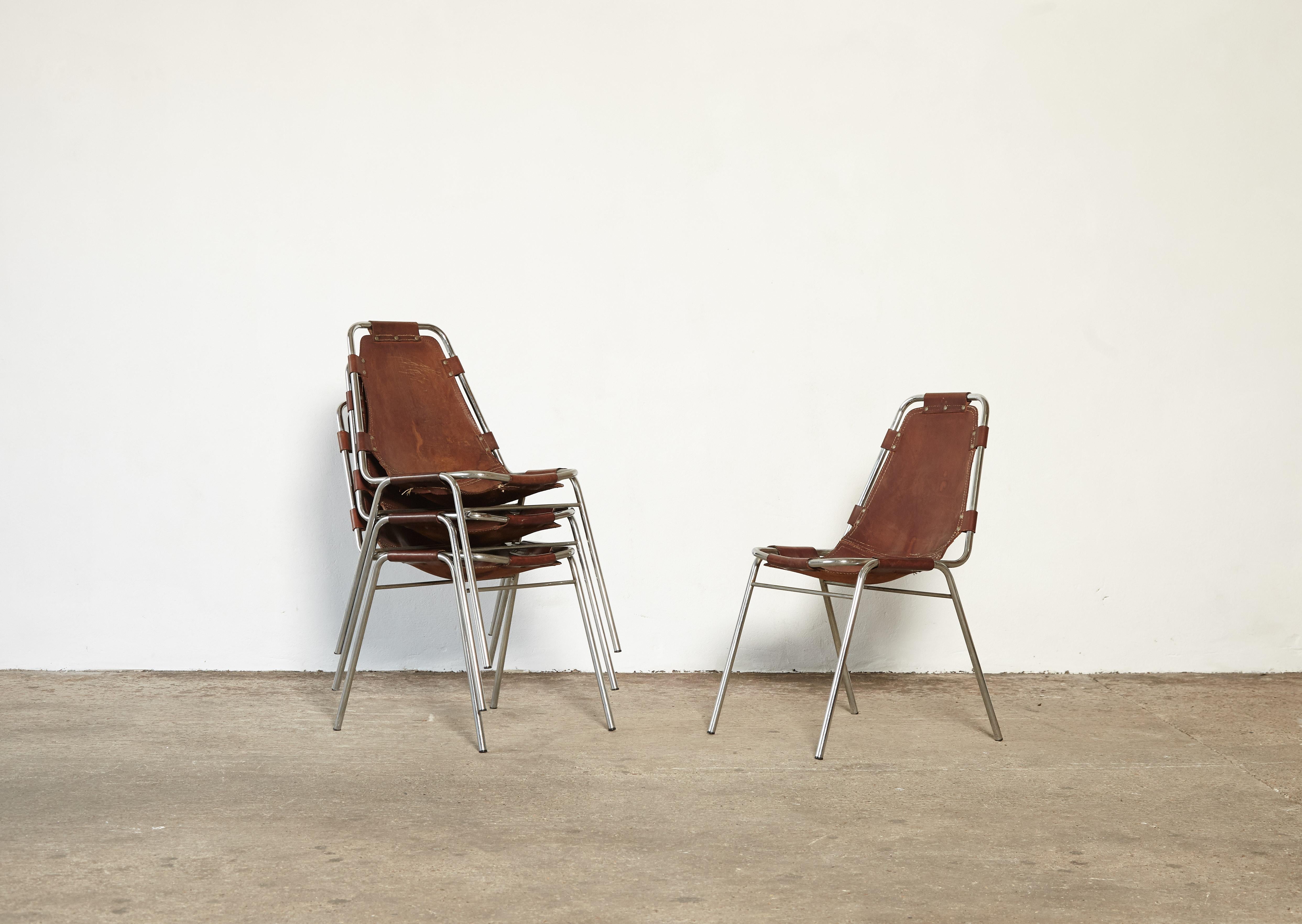 'Les Arcs' chairs in tubular steel and cognac leather, France or Italy, 1970s. Patinated original leather. Ships worldwide.

Les Arcs was a project on which Charlotte Perriand collaborated with some other architects who developed the interiors as