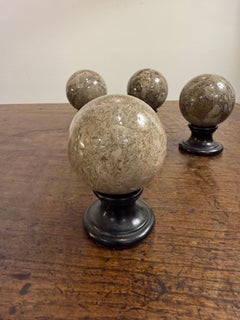 A Set of 4 Neoclassical Style Polished Stone Spheres, Early 20th Century