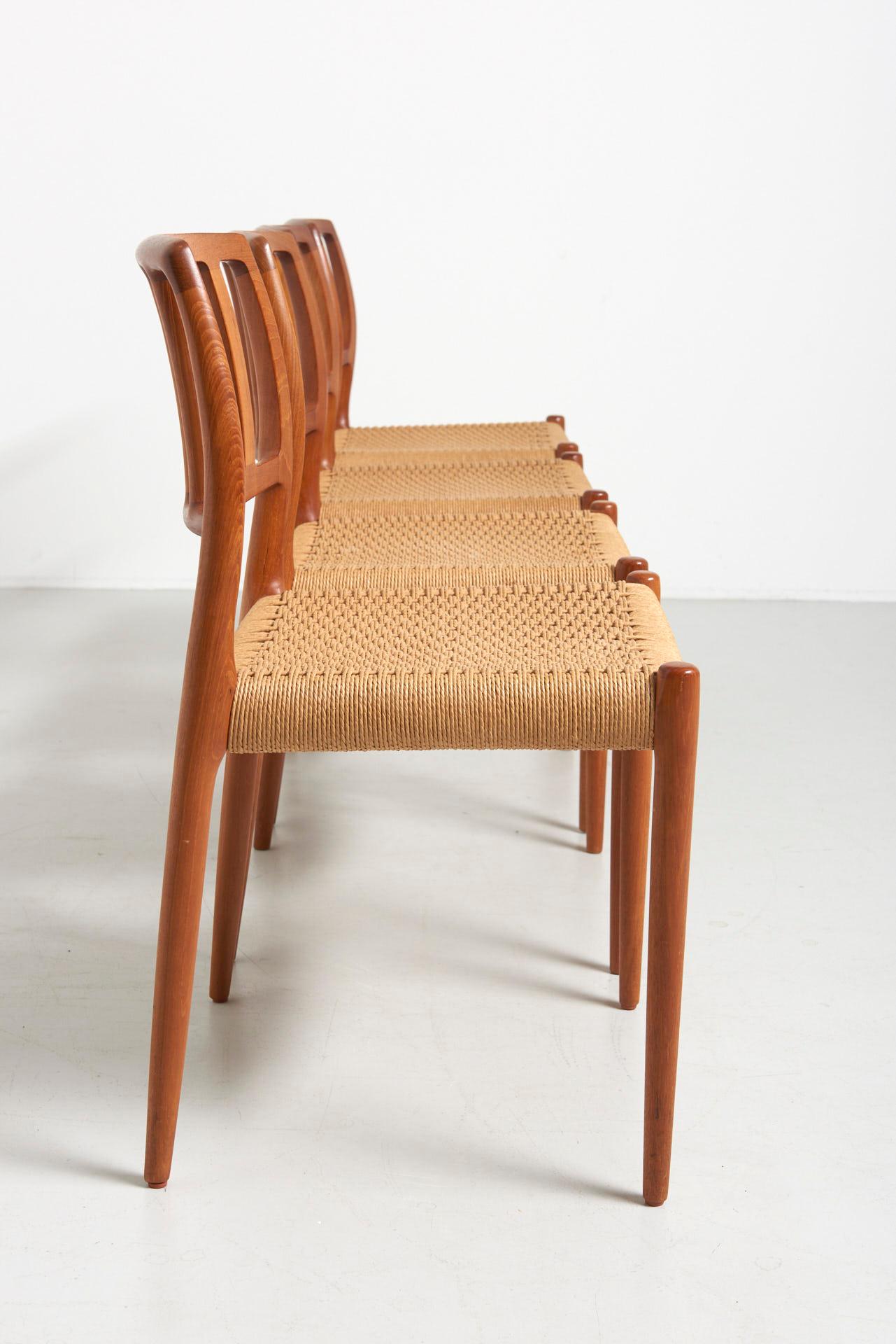 Scandinavian Modern Set of 4 Papercord Dining Chairs in Teak Model 83 Designed by Niels O. Møller
