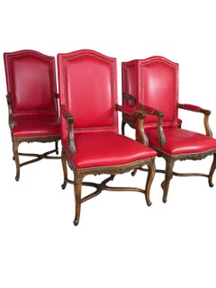 A set of 4 Red Leather Louis XV Armchairs