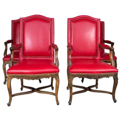 A set of 4 Red Leather Louis XV Armchairs