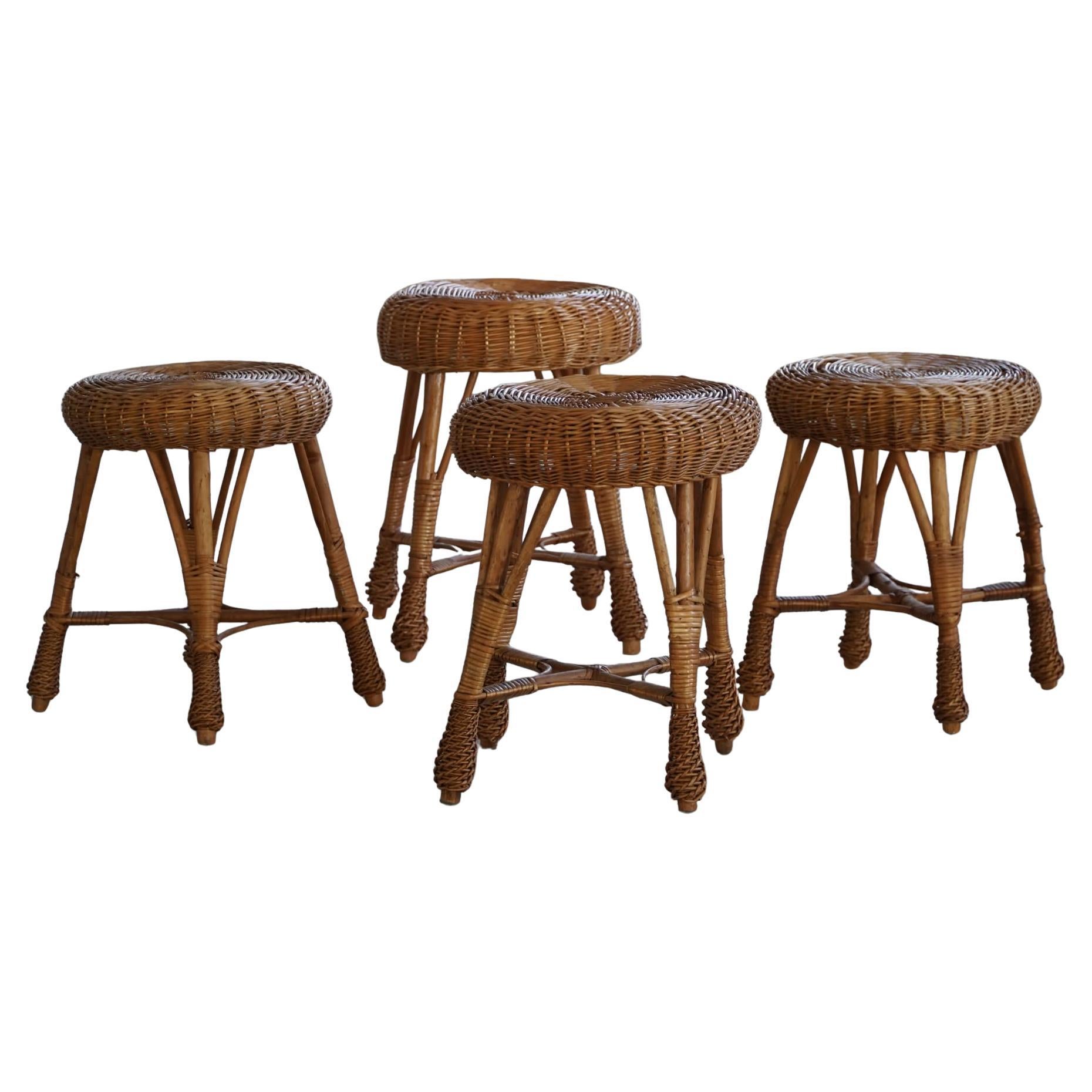 A set of 4 Scandinavian Vintage Stools in Rattan, in Style of Tony Paul, 1960s