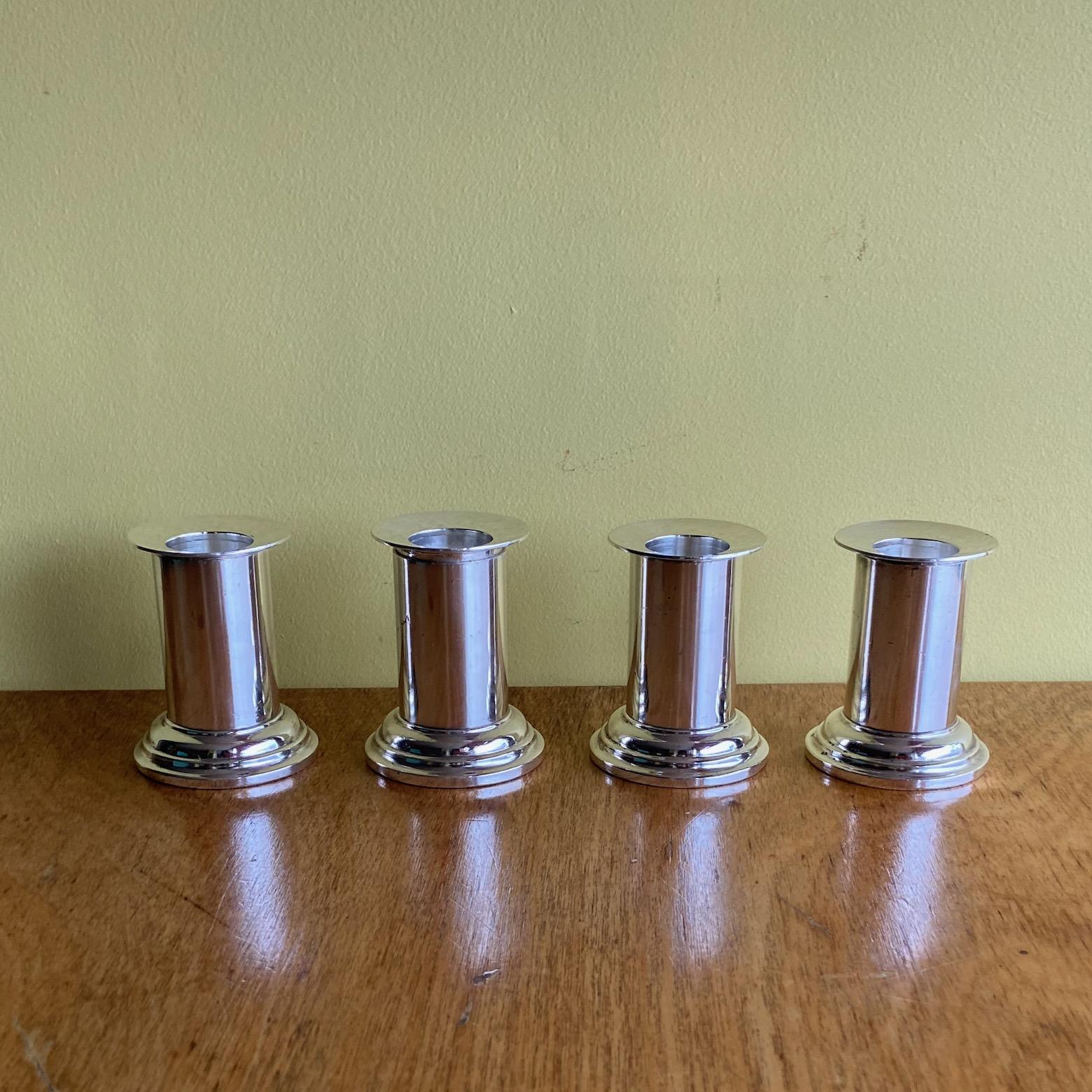 A set of 4 small silver plated modernist candlesticks, A. Krupp Milano, attributed to Gio Ponti. good quality and design.
Provenance, Touring Hotel, Riccione. 
A. Krupp marks. circa 1930's to 1950's.
Beautiful design and quality.

Please note that