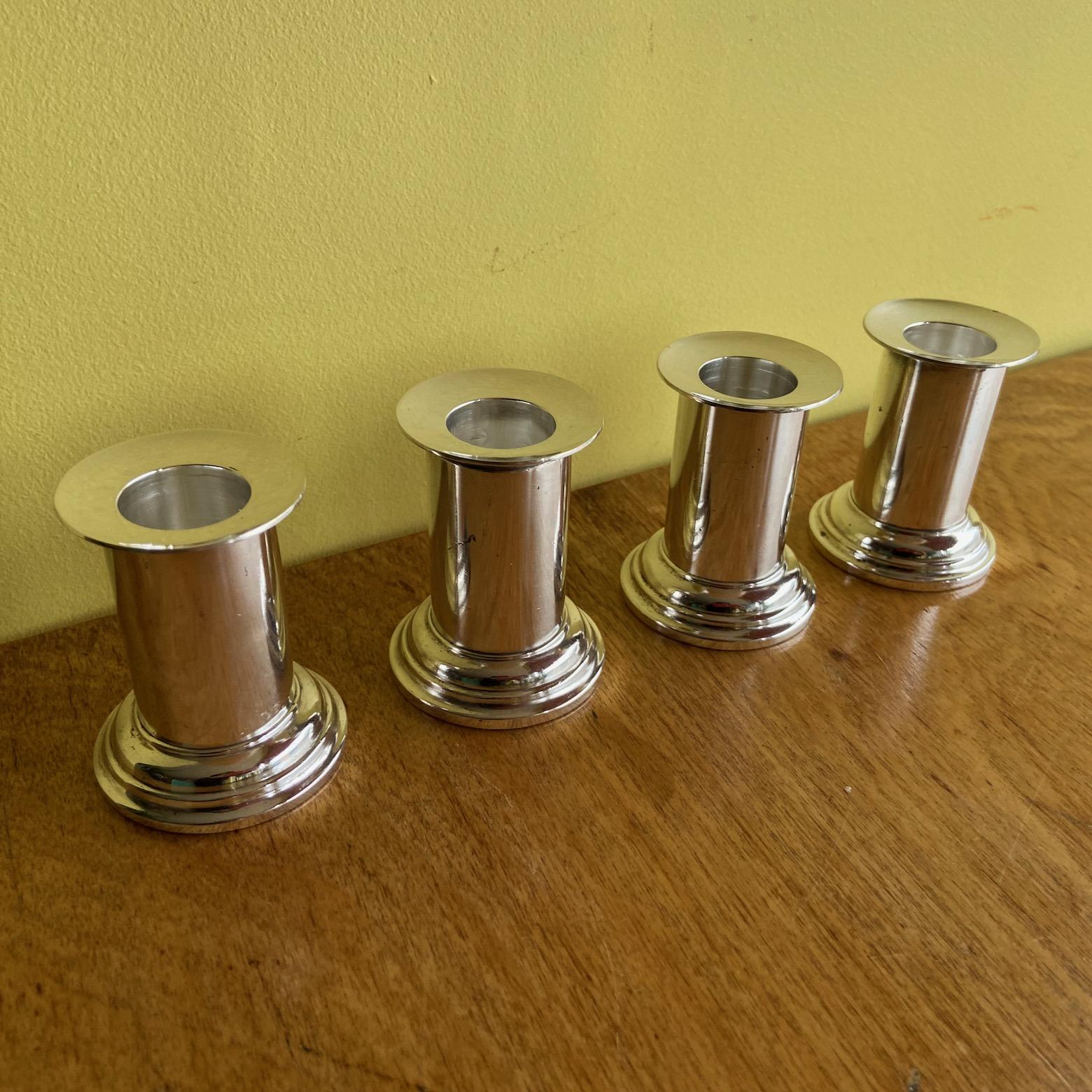 Silvered A set of 4 small silver plated candlesticks, A. Krupp Milano, att. to Gio Ponti