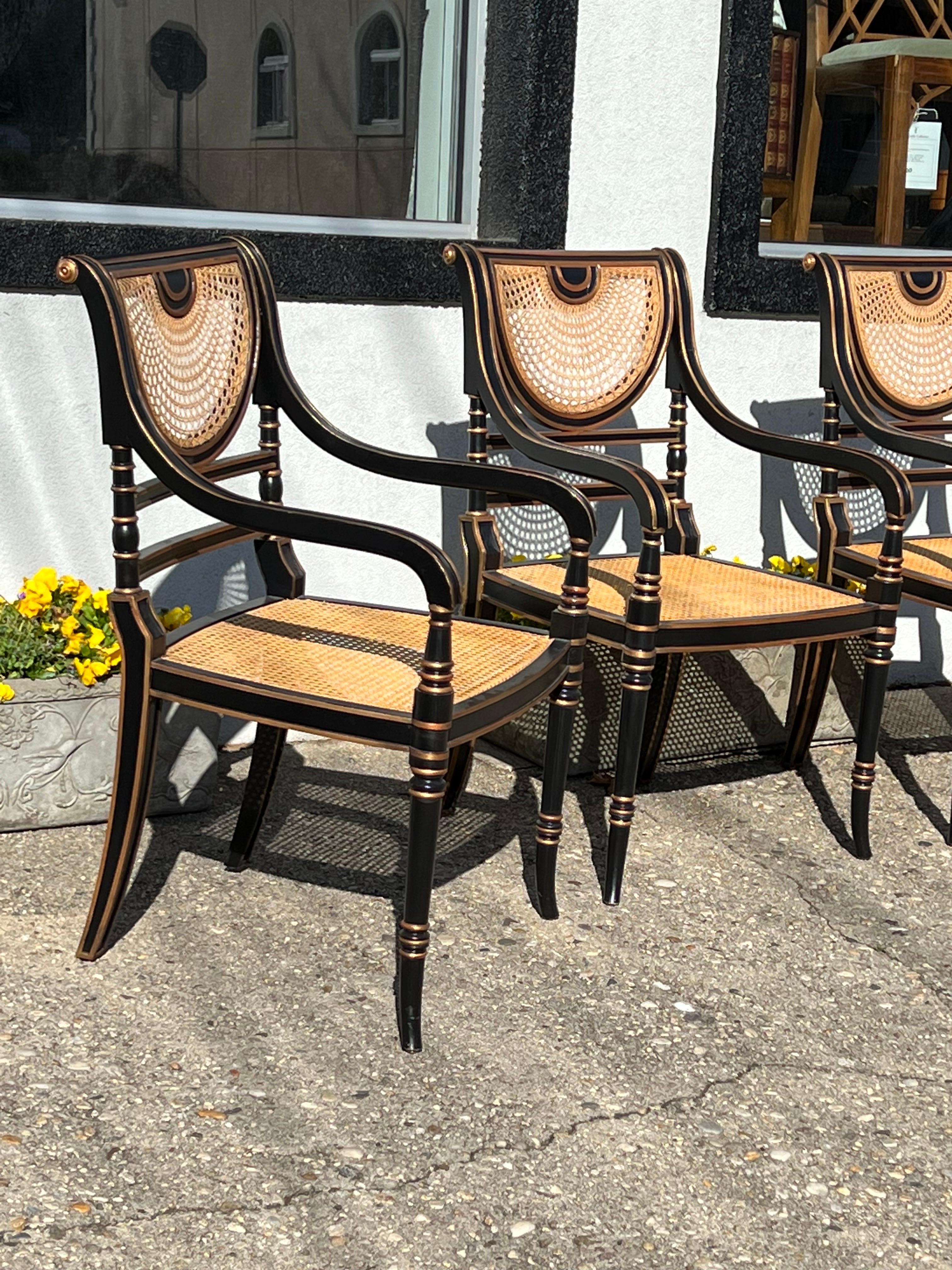 A set of 4 Smith & Watson Regency Style Caned Armchairs.
Each Armchair with tie on loose seats, used but presentable condition. 
Chairs were touched up and waxed.