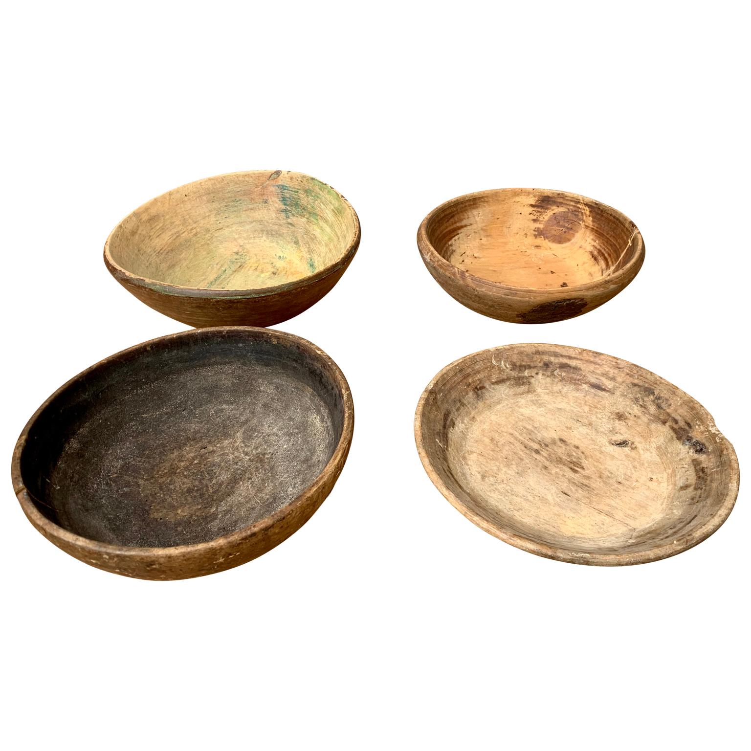A set of 4 allmoge Swedish wooden Folk Art bowls in birch. In their original color and patina, these types of wooden bowl were used for the preparation and storage of food in the rustic countryside life.

   
