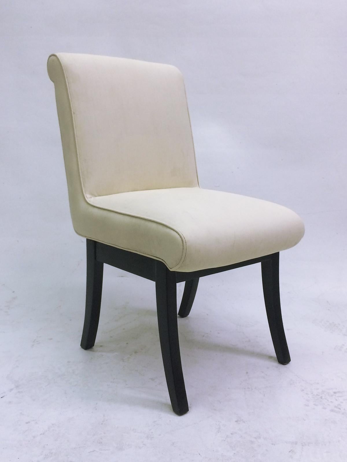 4 Chairs made of ebony stained mahogany legs with off-white original Naugahyde coverings. 
Very comfortable!