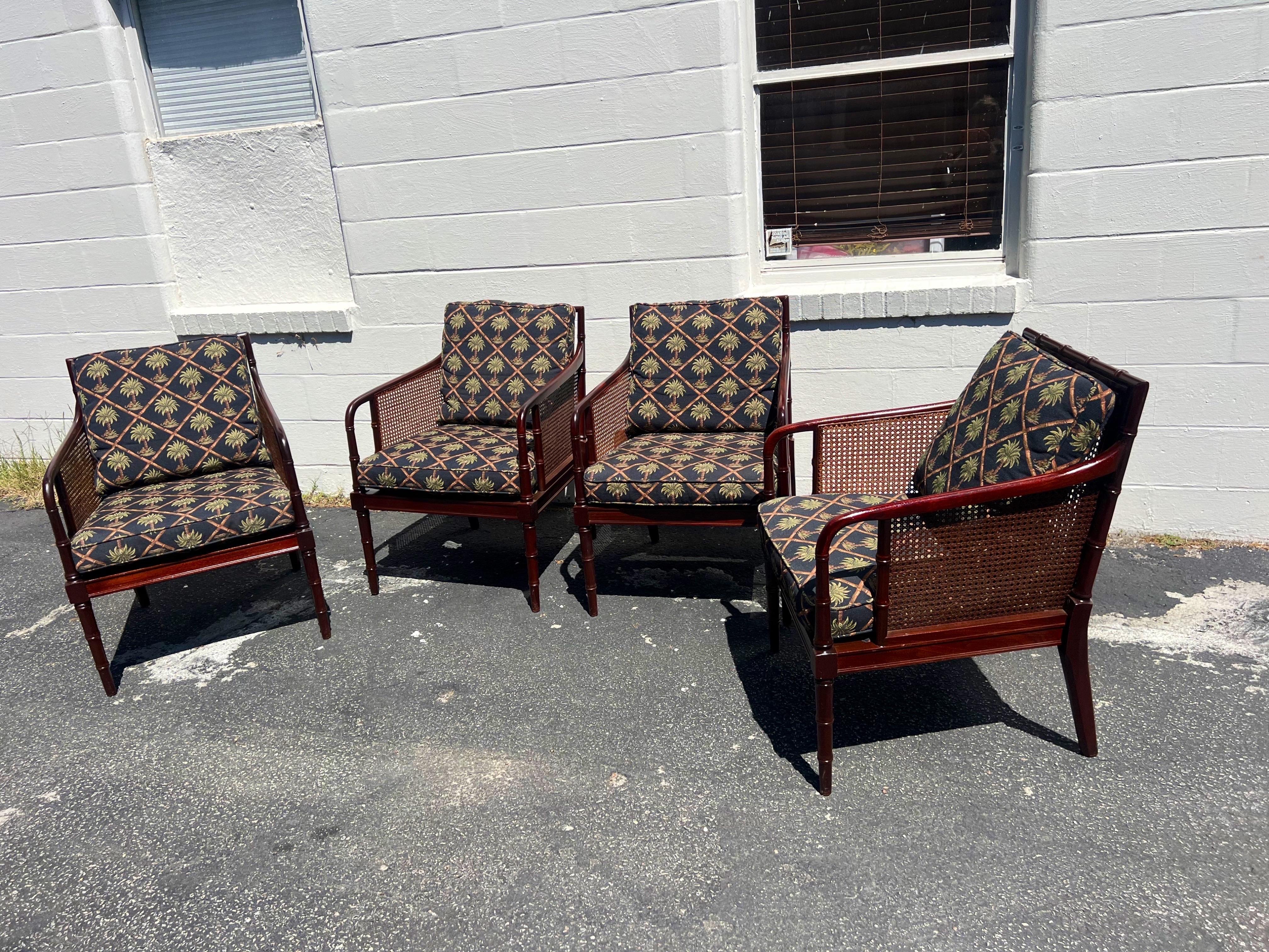 A set of 4 Anglo-indian style mahogany caned armchairs by Hickory Chair Company. 
Seat height with both cushions 19.5”. Newly refinished frames, original caning with no damage. These versatile chairs are great as dining chairs, but cozy enough to