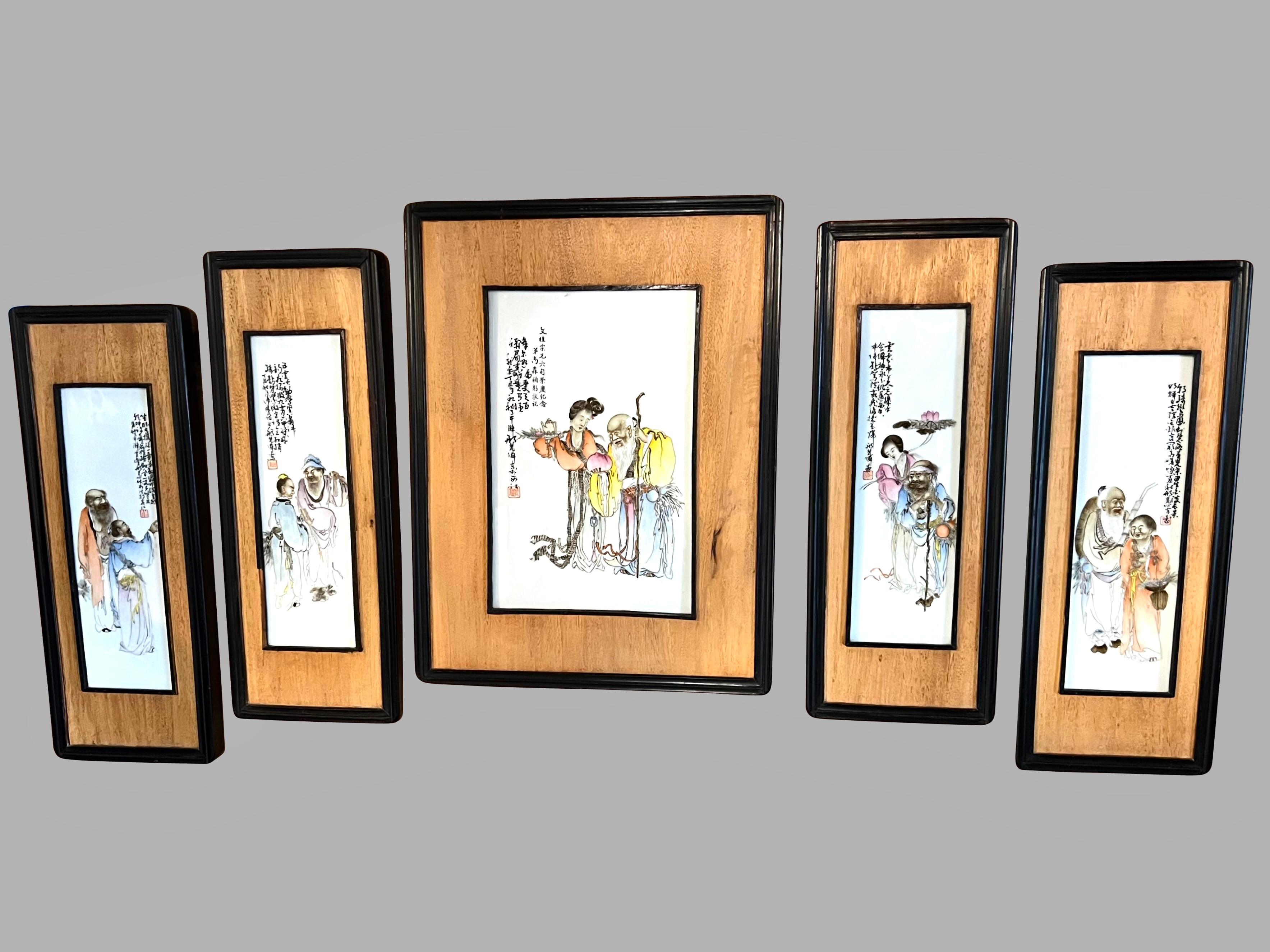 A well-executed group of framed Chinese paintings on porcelain plaques depicting traditionally garbed figures consisting of one medium sized plaque with a young woman serving tea to a elderly scholar signed with a red seal mark middle left, and a