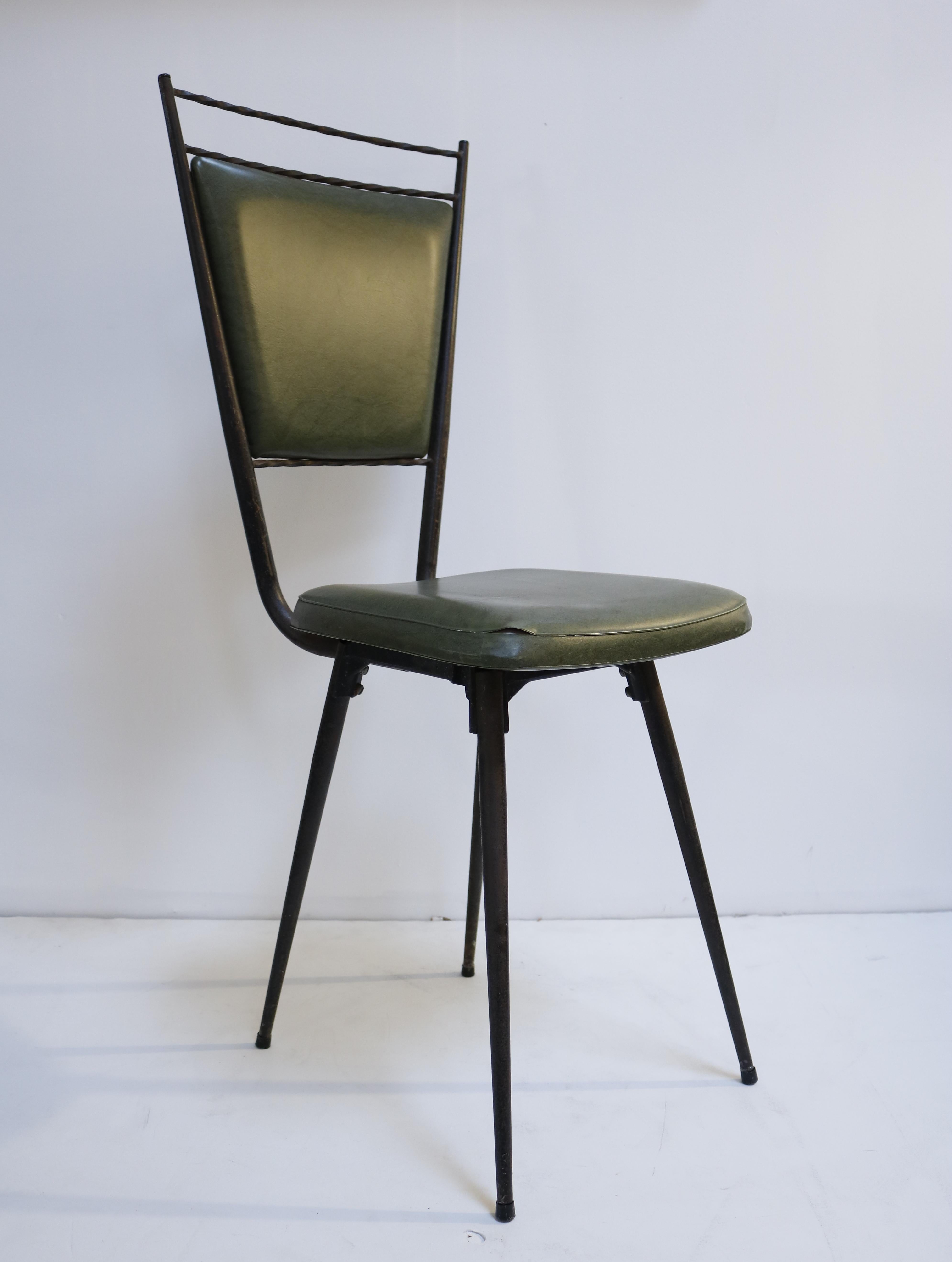 These chairs are made of wrought iron. Their back and seat retain their original green vinyl.
They feature hairpin legs and twisted top.