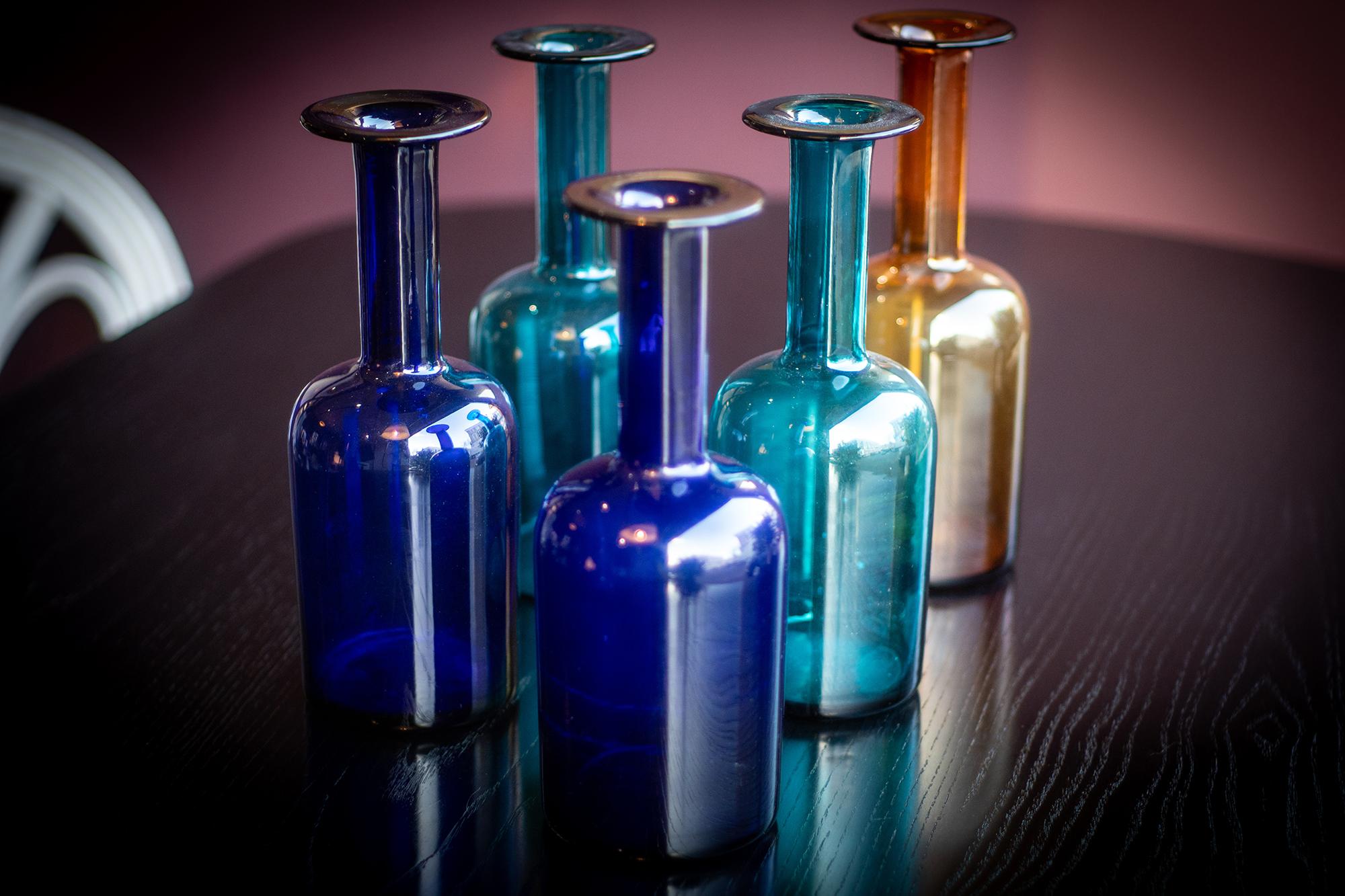 A set of five Gulvvase vases in brilliant midcentury hues of deep green, cobalt blue, cyan and amber. The Gulvvase was originally first designed by Otto Brauer in 1935.