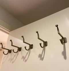 a set of 5 mid-century modernist metal coat or hat hooks or hangers