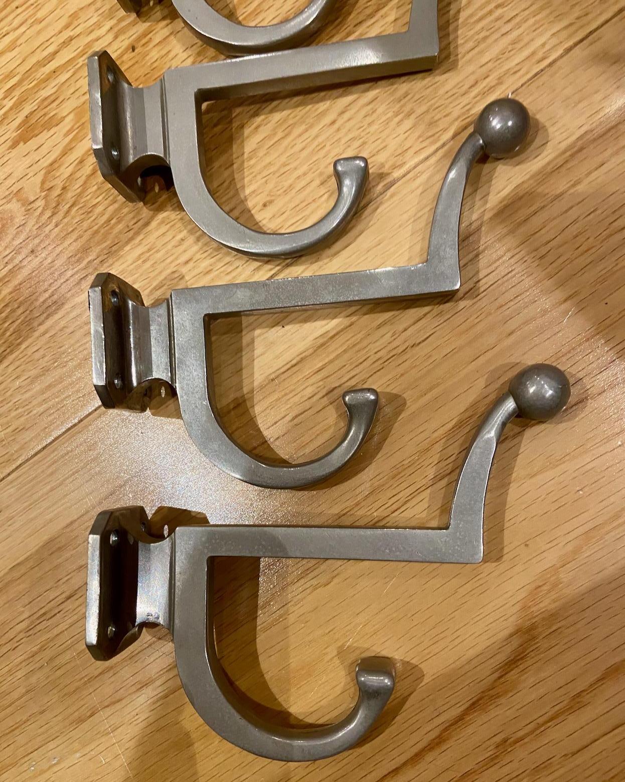 Metal a set of 5 mid-century modernist metal coat hooks or hangers For Sale
