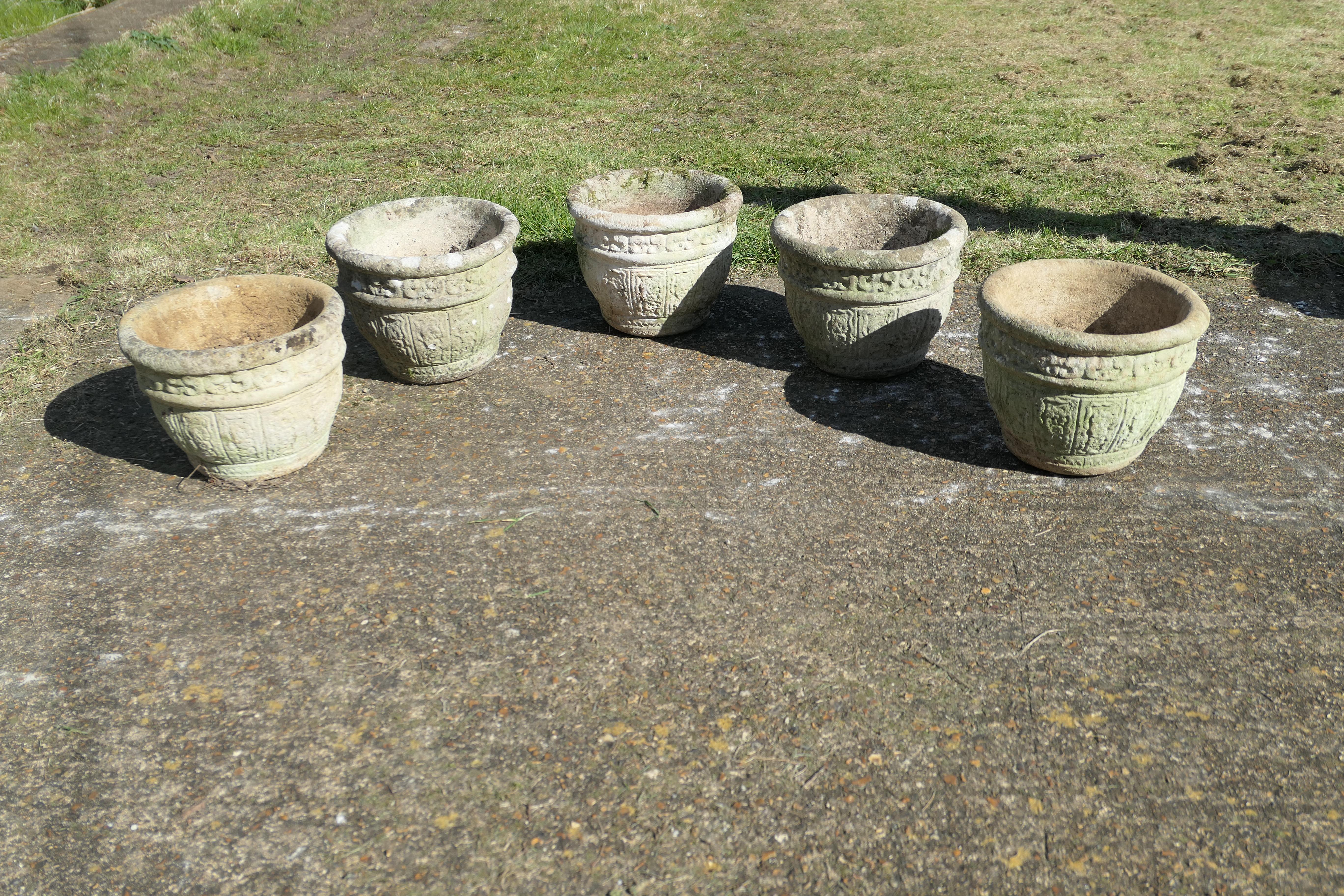 A set of 5 Studio Stonehouse Cotswold Planters

This is a good large set, 5 in all, the planters are round and they have drainage hole at the centre, they have been made and decorated by hand and they have good natural weathered patination
The