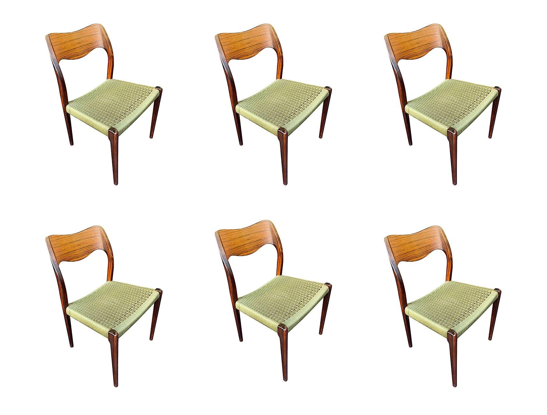 A set of 6 1950s orignal Niels Moller, Model  71 chairs designed by Neils O. Moller and made in Denmark by J L Moller, in rare rosewood with orignal green cord strung seats. All with orignal Moller and Danish manufacturing button labels underneath.