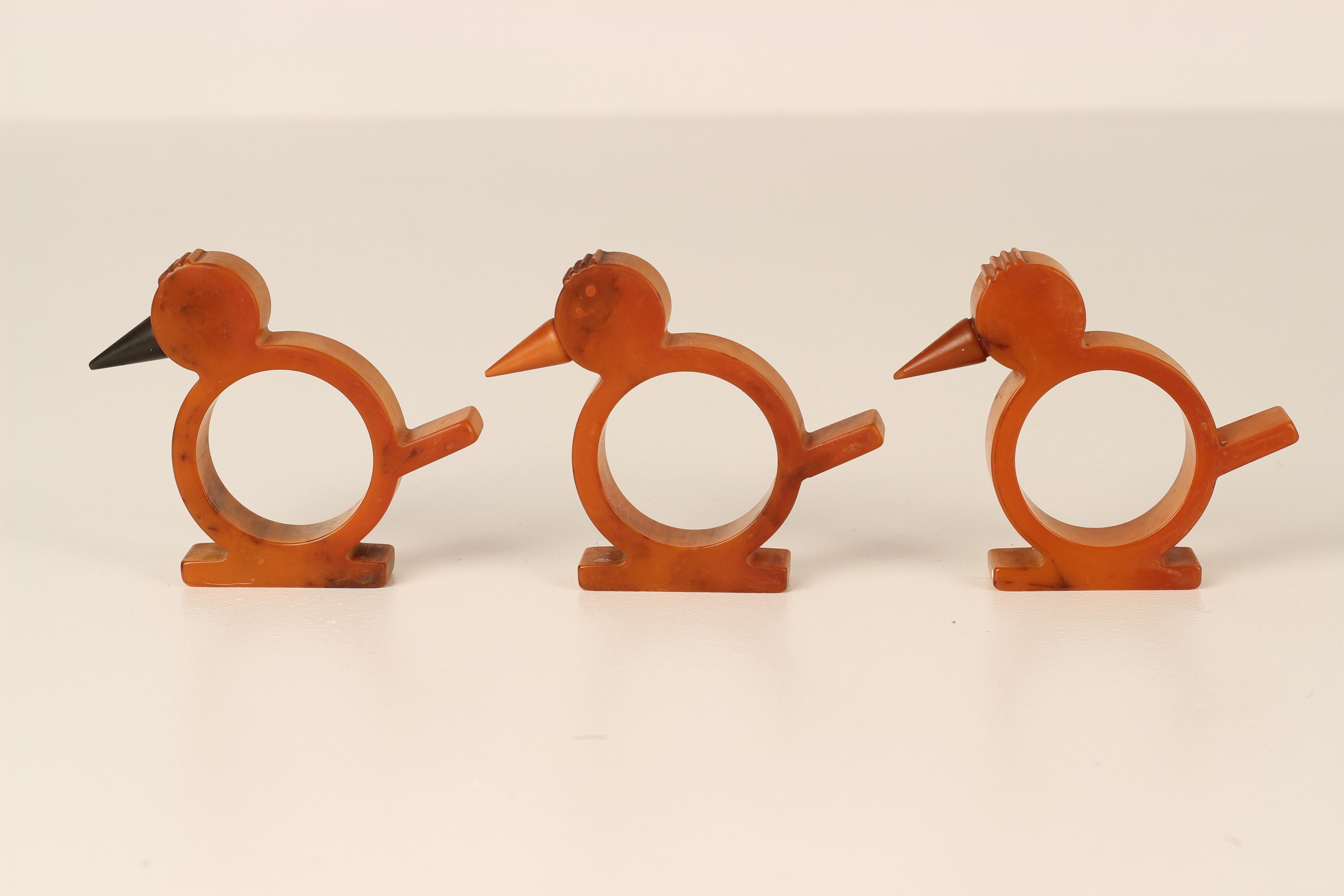 A set of 6 bakelite Art Deco Napkin rings in the stylised design of Birds. The Rings have a wonderful tonal quality. The internal diameter for one napkin ring is 3.5cms.

General note: Shipping quotes as supplied by 1stdibs are only indicative. We