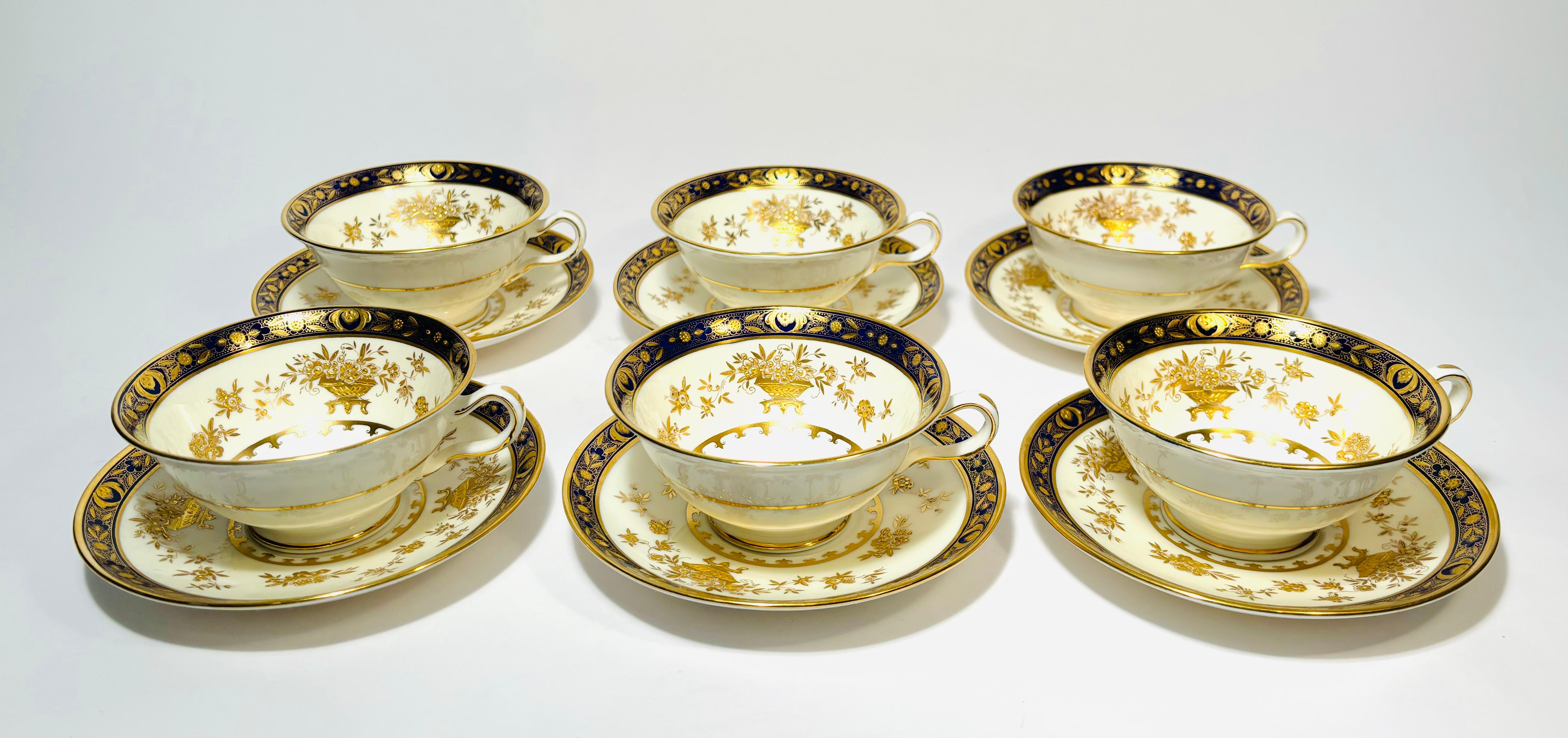 From one of our favorite Gilded Age Factories, Minton, we have a set of 6 cups and 6 Saucers. From their storied Dynasty pattern featuring raised gold accents and cobalt blue color. A nice pedestal shaped cup and generous saucer. The cup measures